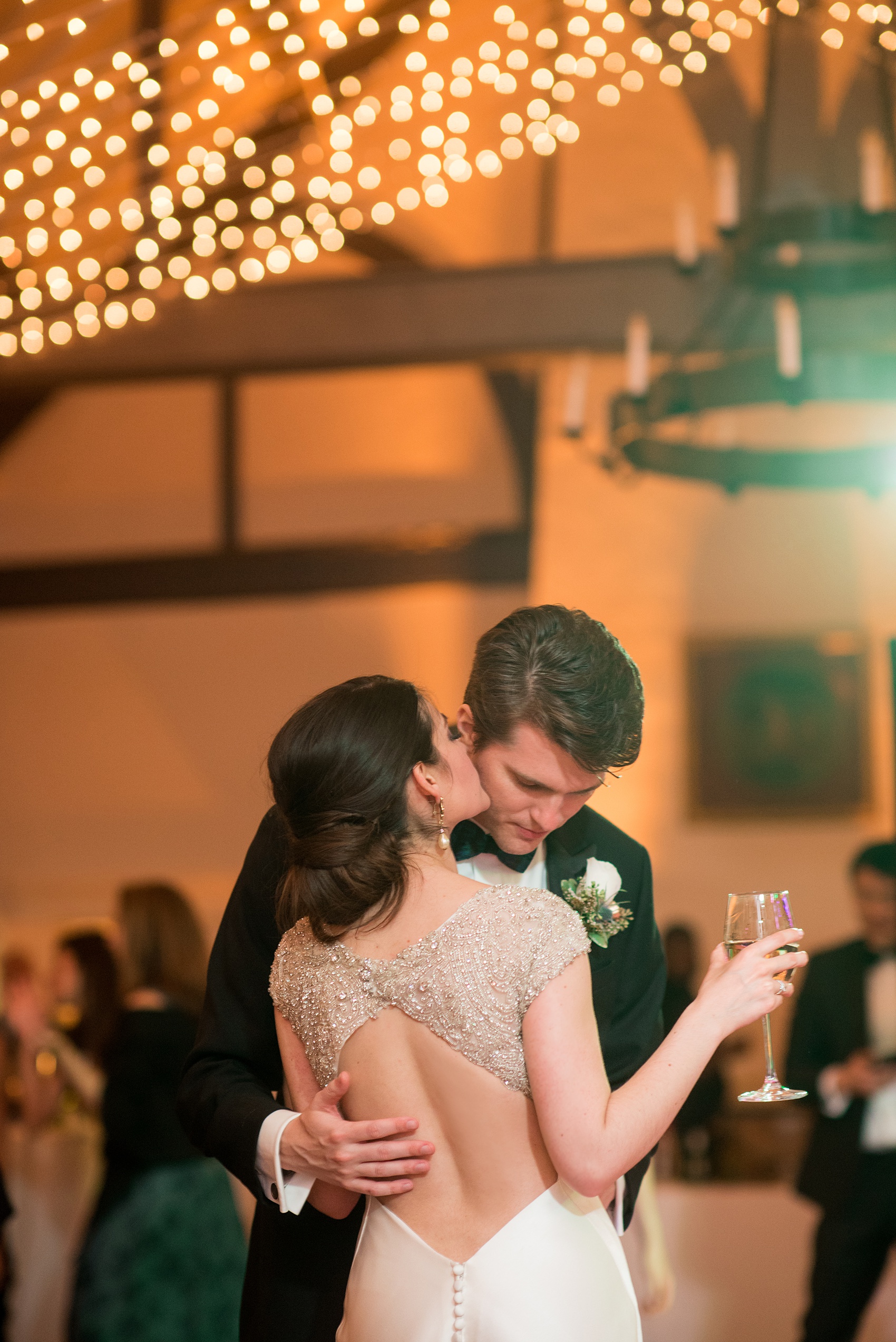 Mikkel Paige Photography photo of a wedding reception at Hope Valley Country Club in Chapel Hill, NC. Picture of the bride bride's second gown, dancing with her groom.