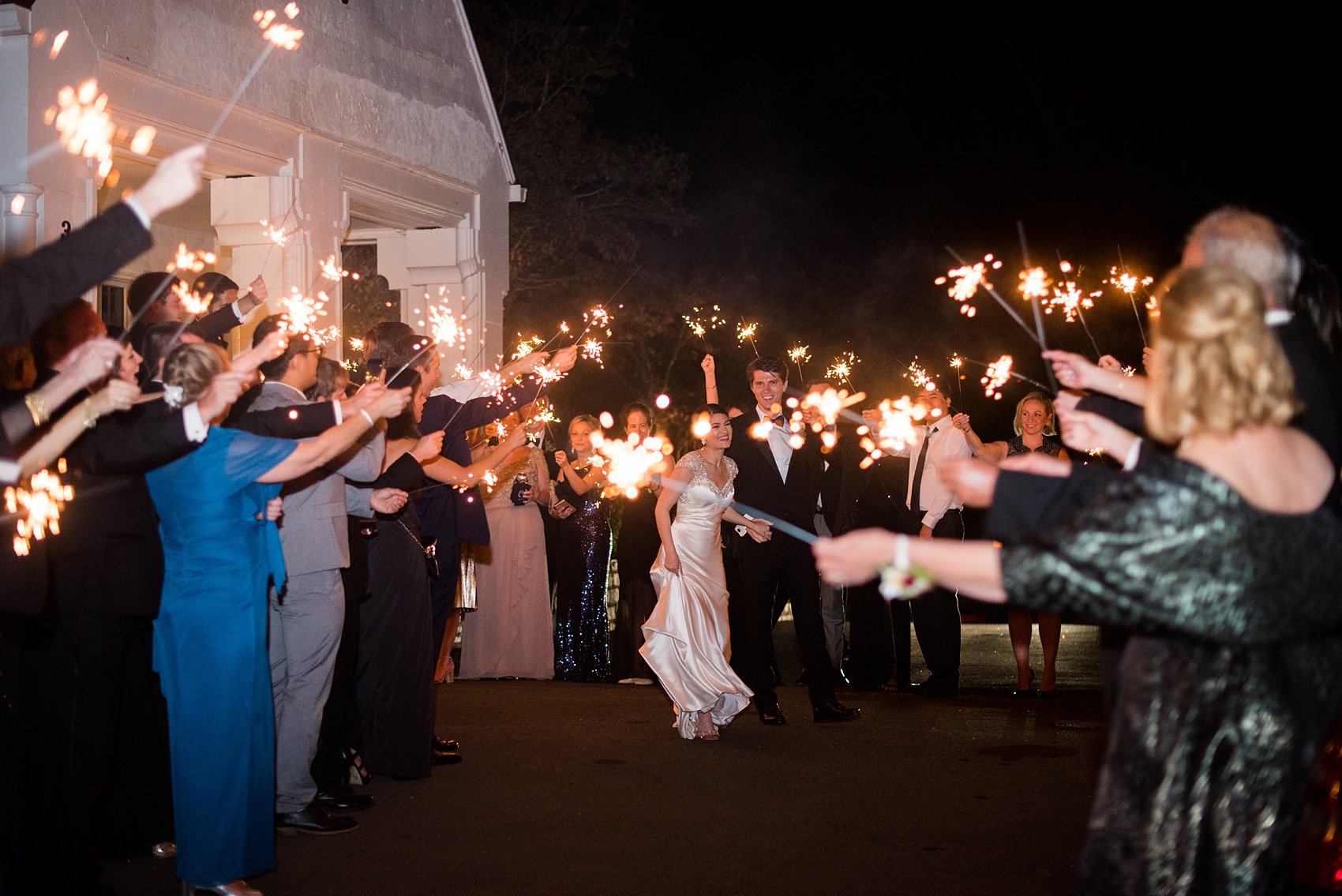 Mikkel Paige Photography photo of a wedding reception at Hope Valley Country Club in Chapel Hill, NC. Picture of the bride and groom during their sparkler exit.