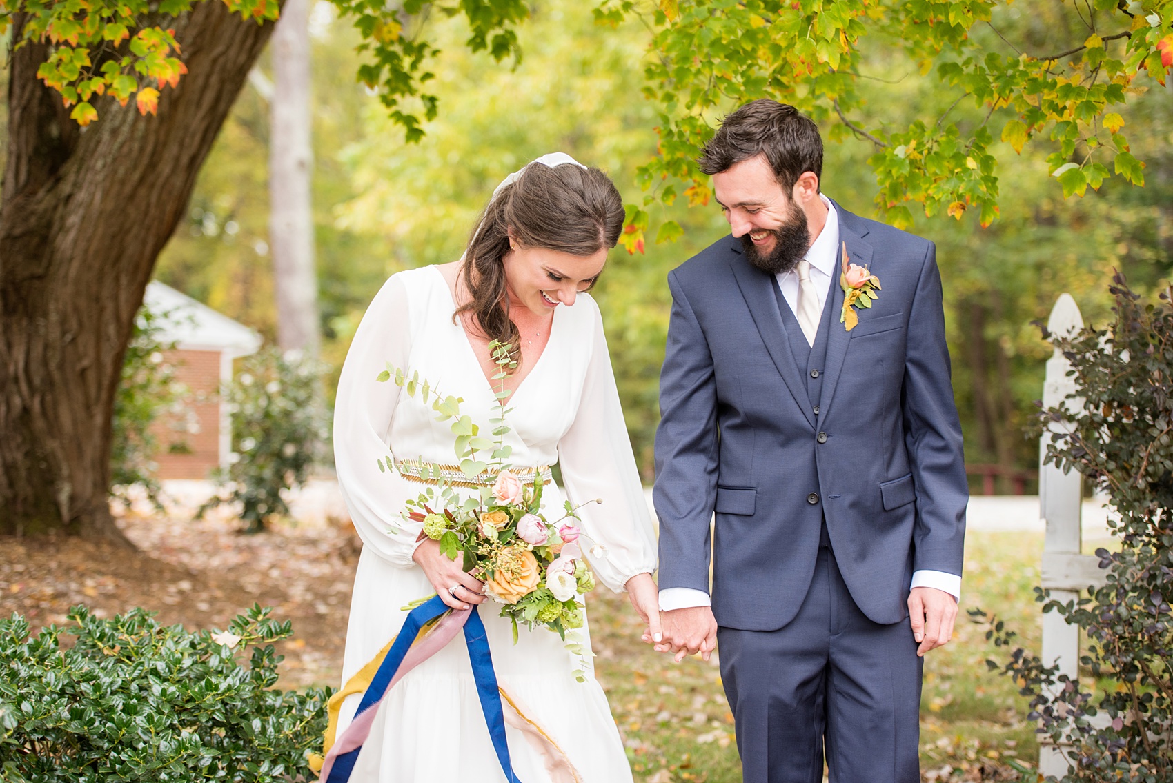 Mikkel Paige Photography photos from a wedding at Leslie-Alford Mims House in North Carolina. Picture of the Boho bride and groom in a navy suit for their fall day.