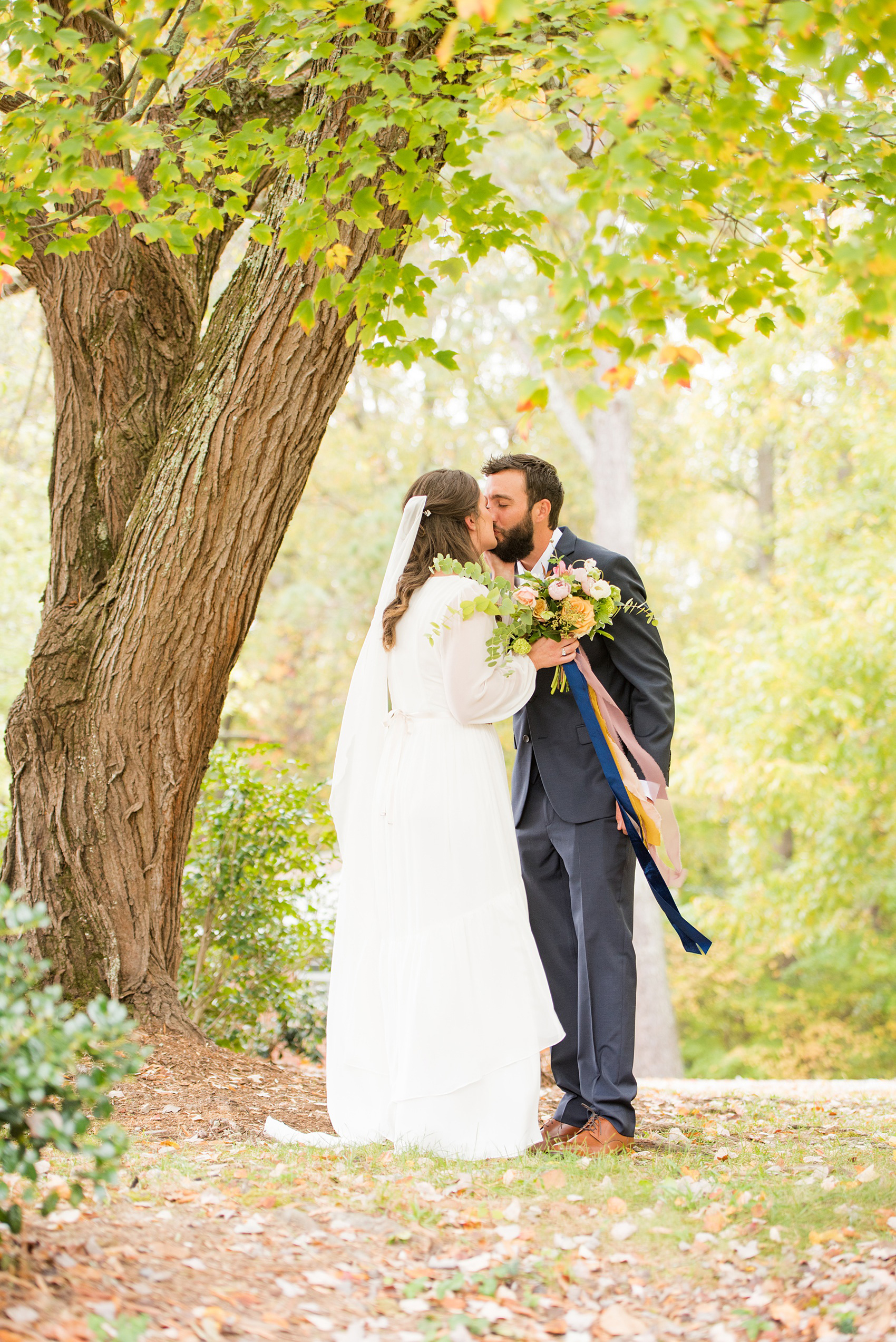 Mikkel Paige Photography photos from a wedding at Leslie-Alford Mims House in North Carolina. Picture of the bride and groom during their boho Mad Dash Wedding.