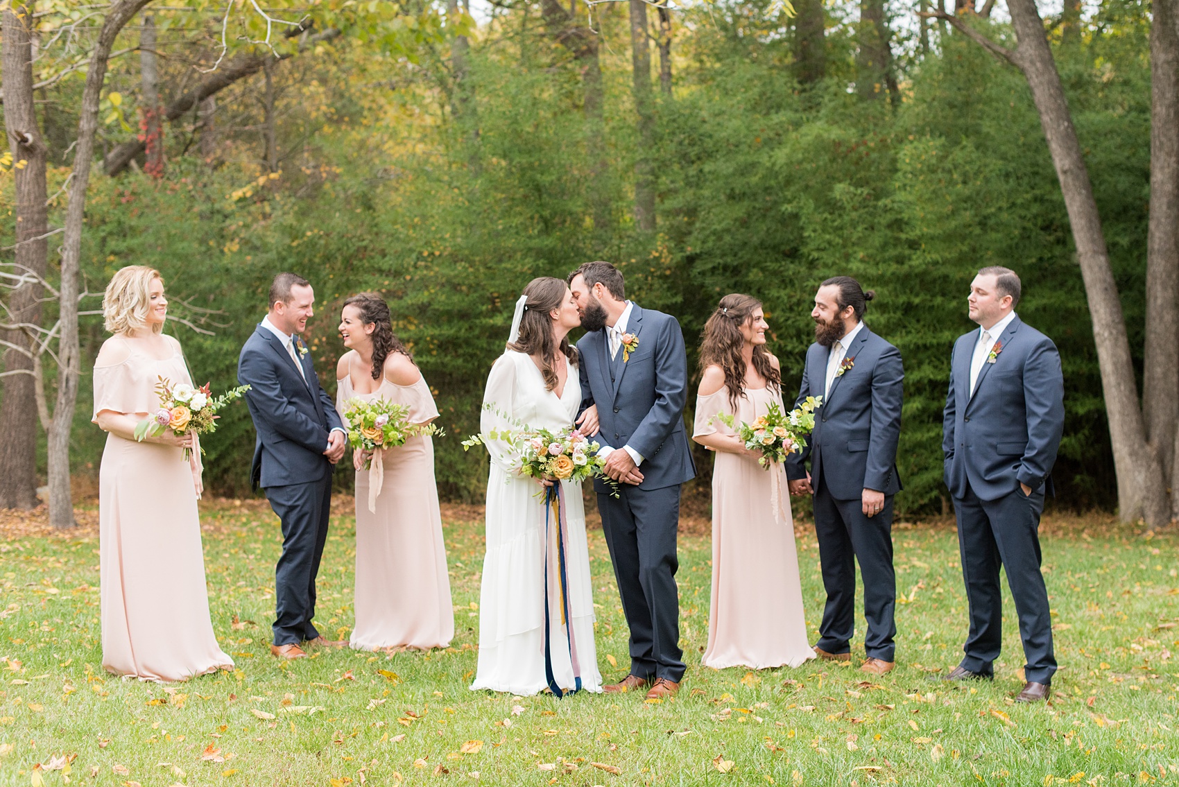 Mikkel Paige Photography photos from a wedding at Leslie-Alford Mims House in North Carolina. Picture of the wedding party in navy blue linen suits and light pink chiffon dresses for a fall Mad Dash Weddings event.