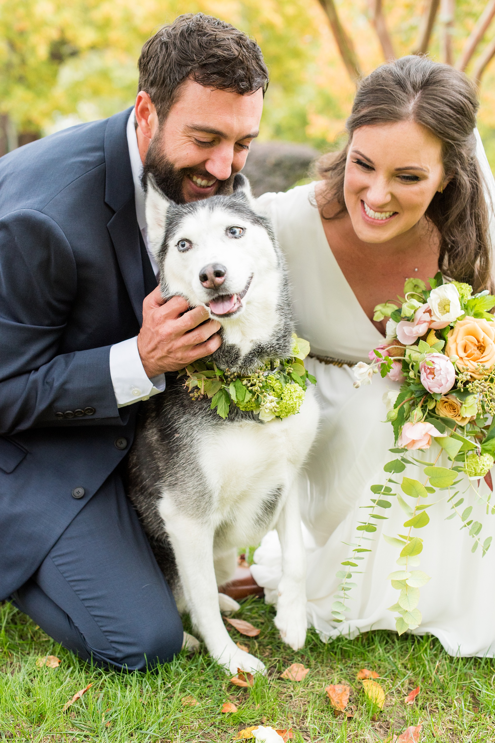 Mikkel Paige Photography photos from a wedding at Leslie-Alford Mims House in North Carolina. Picture of the bride and groom with their Husky dog in a flower collar. 