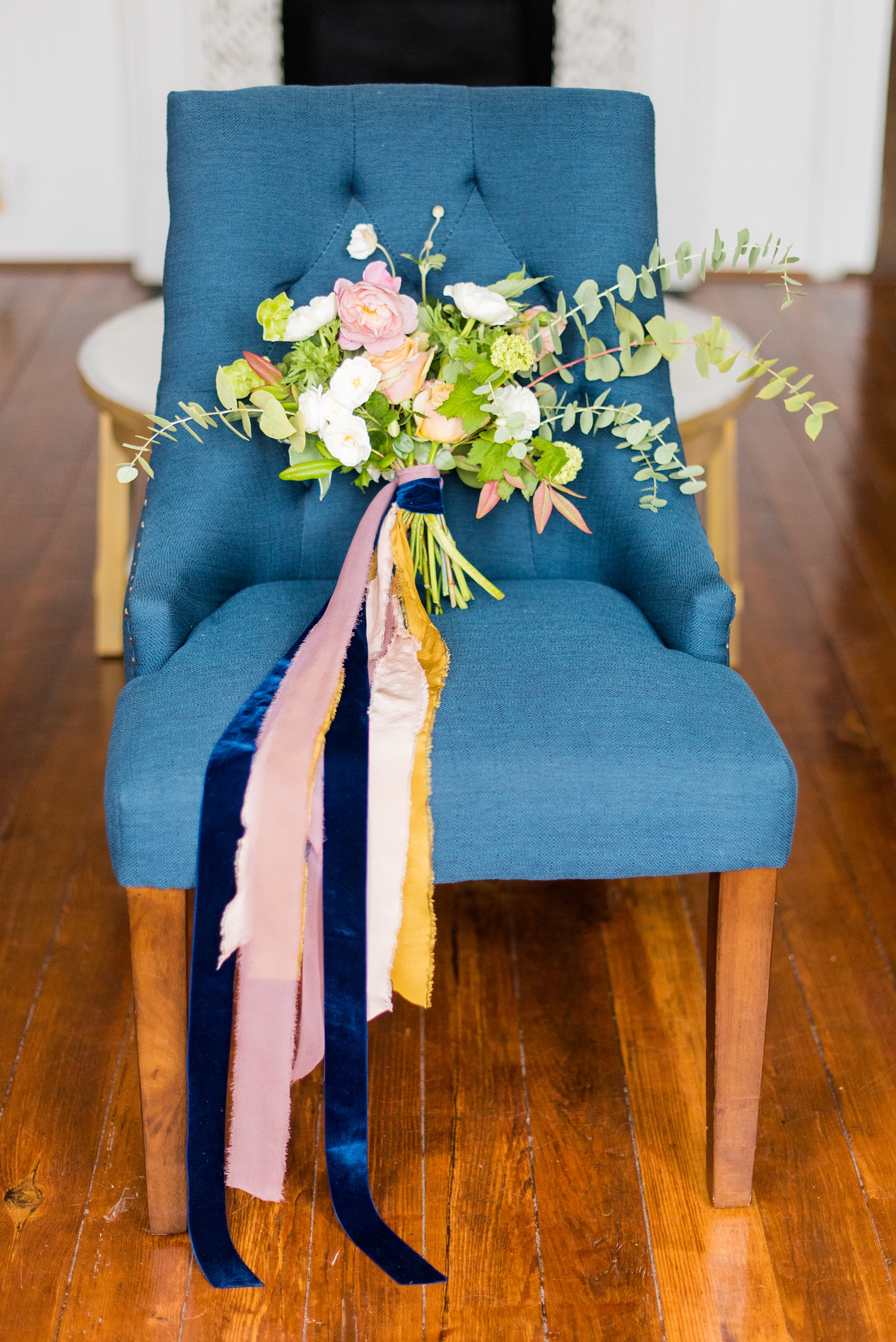 Mikkel Paige Photography photos from a wedding at Leslie-Alford Mims House in North Carolina. Picture of the bride's colorful fall bouquet, tied with silk and velvet ribbons by Caroline Ruth Designs and Mad Dash Weddings.