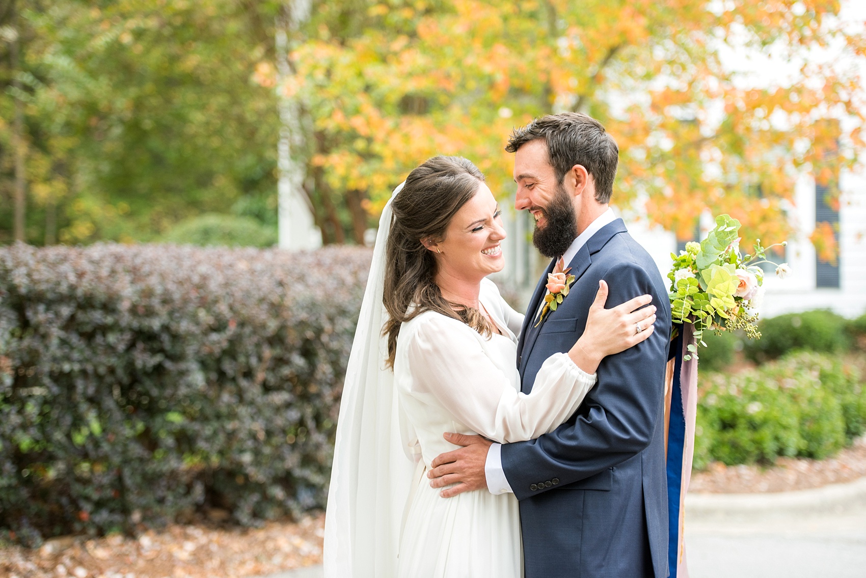 Mikkel Paige Photography photos from a wedding at Leslie-Alford Mims House in North Carolina. Picture of the Boho bride and groom in a navy suit for their fall day.