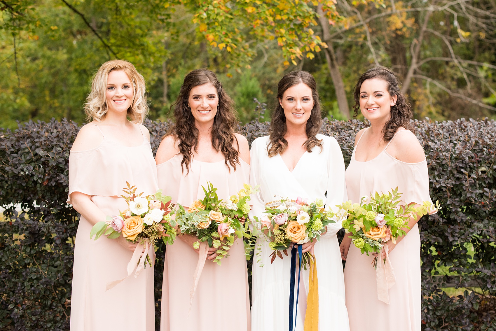 Mikkel Paige Photography photos from a wedding at Leslie-Alford Mims House in North Carolina. Picture of the bridal party in light pink, off-the-shoulder, chiffon dresses for a fall Mad Dash Weddings event.