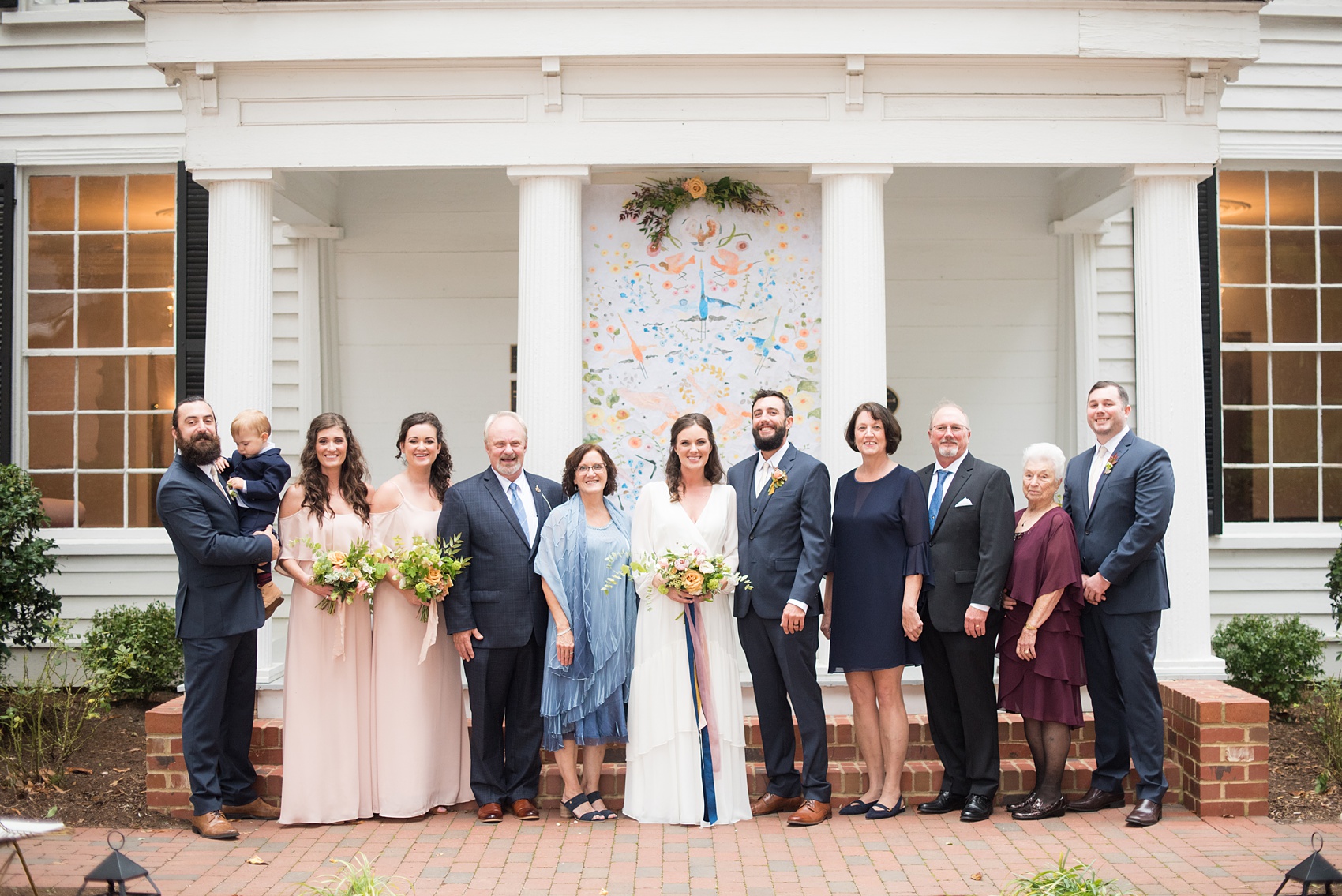 Mikkel Paige Photography photos from a wedding at Leslie-Alford Mims House in North Carolina. Picture of the family in front of the historic southern home where the Mad Dash Weddings ceremony took place.