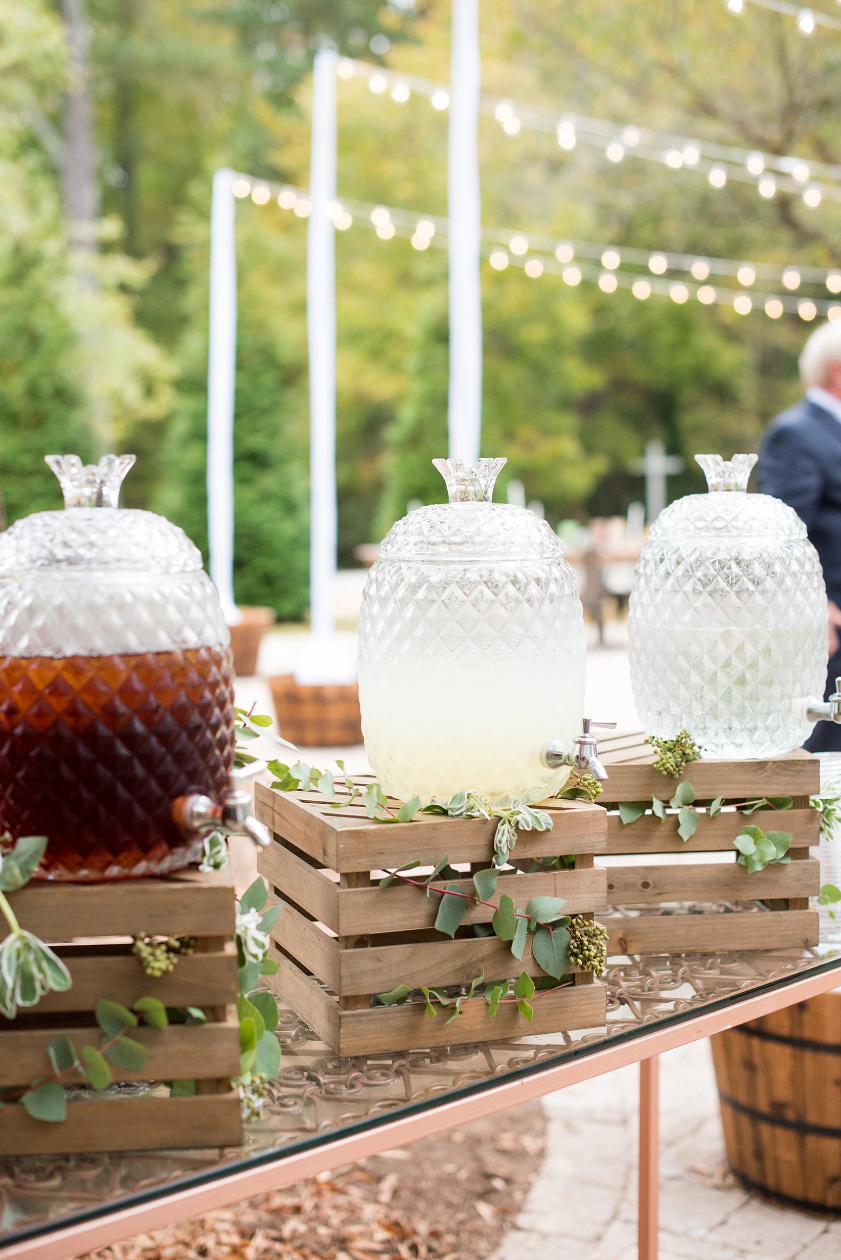 Mikkel Paige Photography photos from a wedding at Leslie-Alford Mims House in North Carolina. Picture of the stylized catering drinks on wooden crates for the boho event.