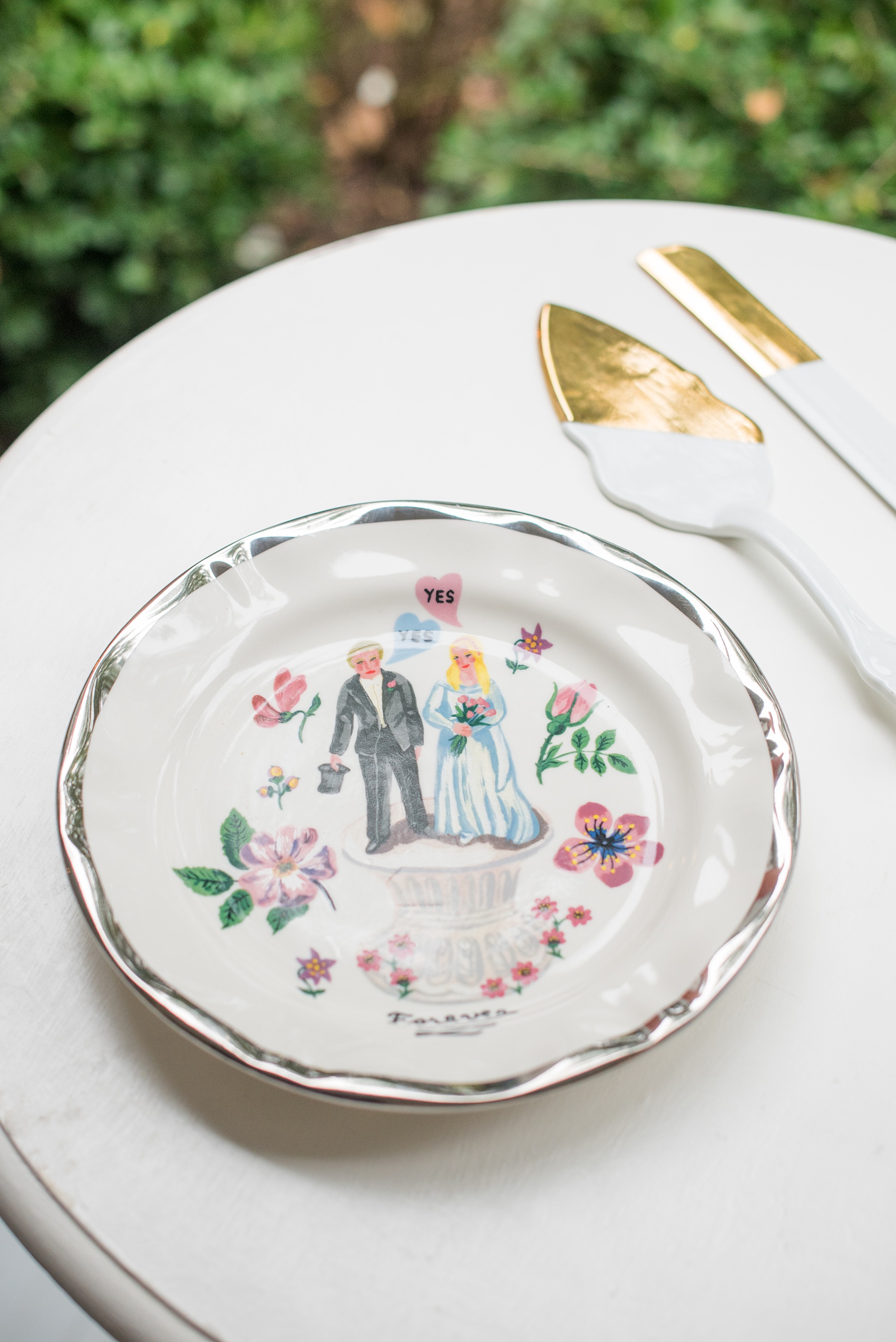 Mikkel Paige Photography photos from a wedding at Leslie-Alford Mims House in North Carolina. Picture of the handpainted cake plate and gold and white serving ware.