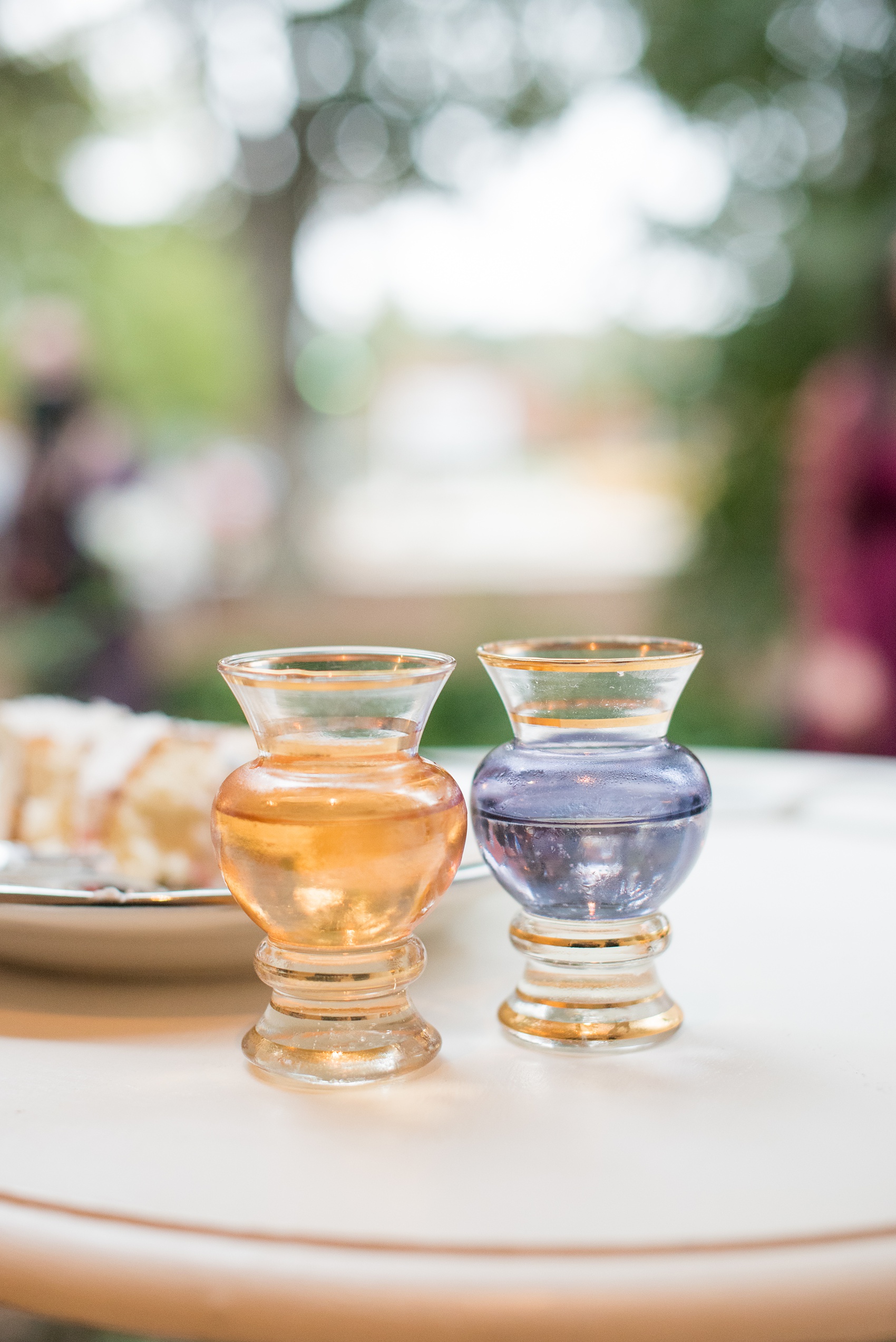 Mikkel Paige Photography photos from a wedding at Leslie-Alford Mims House in North Carolina. Picture of the bride's grandparents colored glass wine cups they used for the cake cutting. 