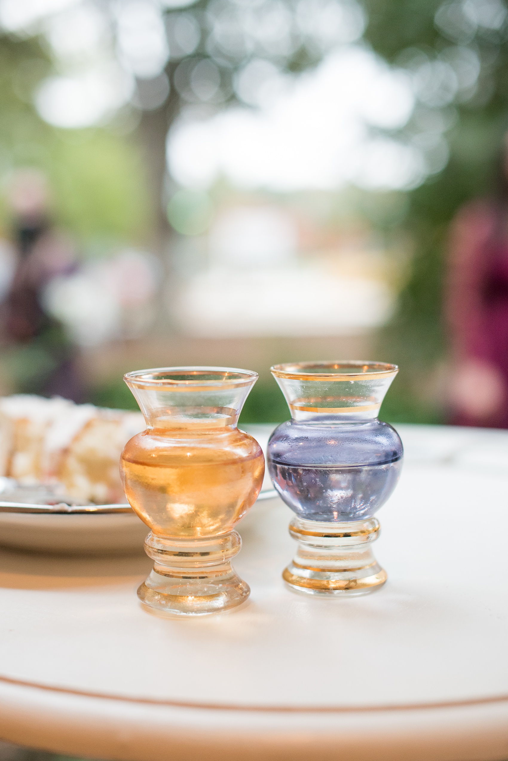 Mikkel Paige Photography photos from a wedding at Leslie-Alford Mims House in North Carolina. Picture of the bride's grandparents colored glass wine cups they used for the cake cutting. 