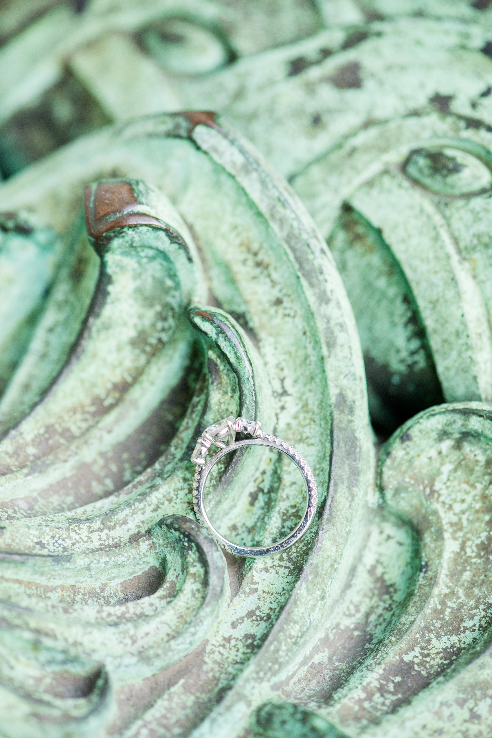 Mikkel Paige Photography engagement photos in lower manhattan near City Hall and the Brooklyn Bridge. Detail picture of the three stone diamond ring.