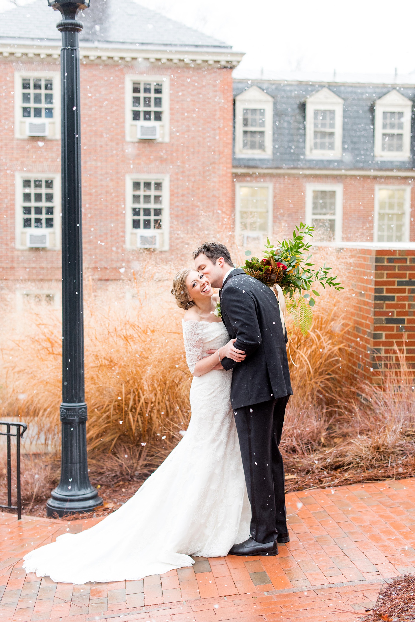Mikkel Paige Photography photos at The Carolina Inn for a warm and colorful winter wedding. Picture of the bride and groom on their snowy day in Chapel Hill, NC. 