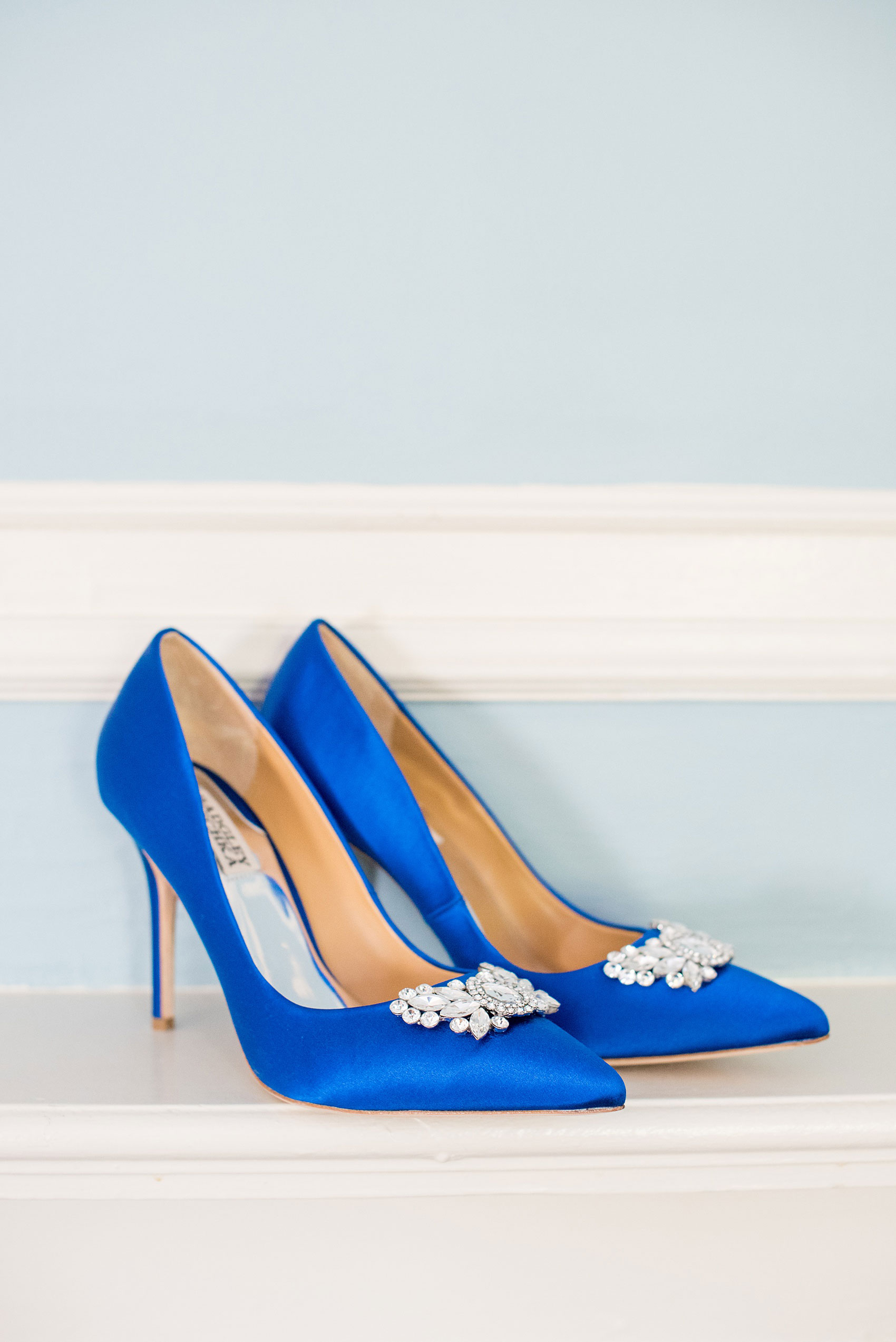 Mikkel Paige Photography photos of a wedding at Crabtree's Kittle House in Chappaqua, New York. Picture of the bride's cobalt "something blue" heels by Badgley Mischka.