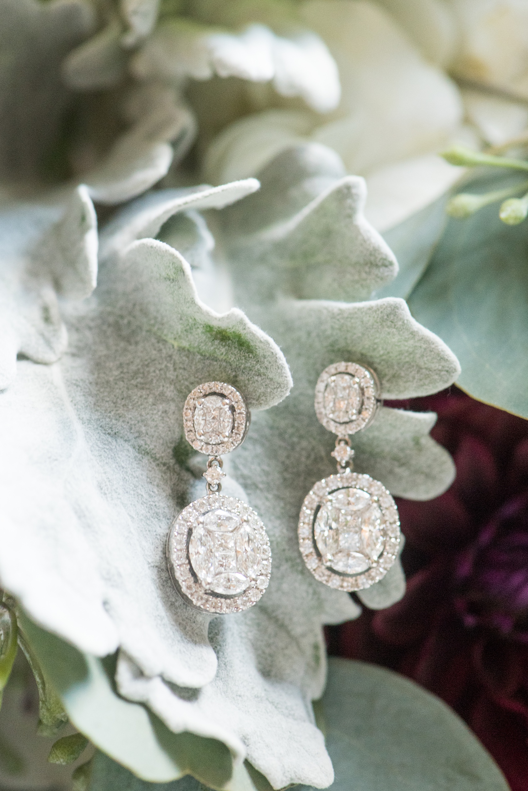 Mikkel Paige Photography photos of a wedding at Crabtree's Kittle House in Chappaqua, New York. Picture of the bride's oval diamond earrings.