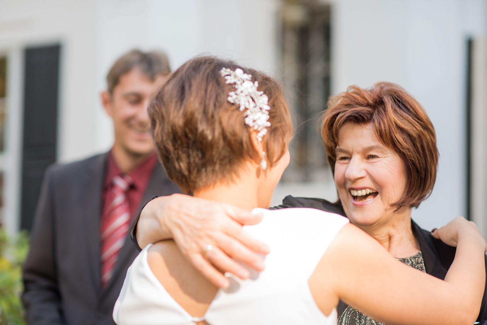 Mikkel Paige Photography photos of a wedding at Crabtree's Kittle House in Chappaqua, New York. Picture of the bride greeting her mother-in-law for the first time that day.