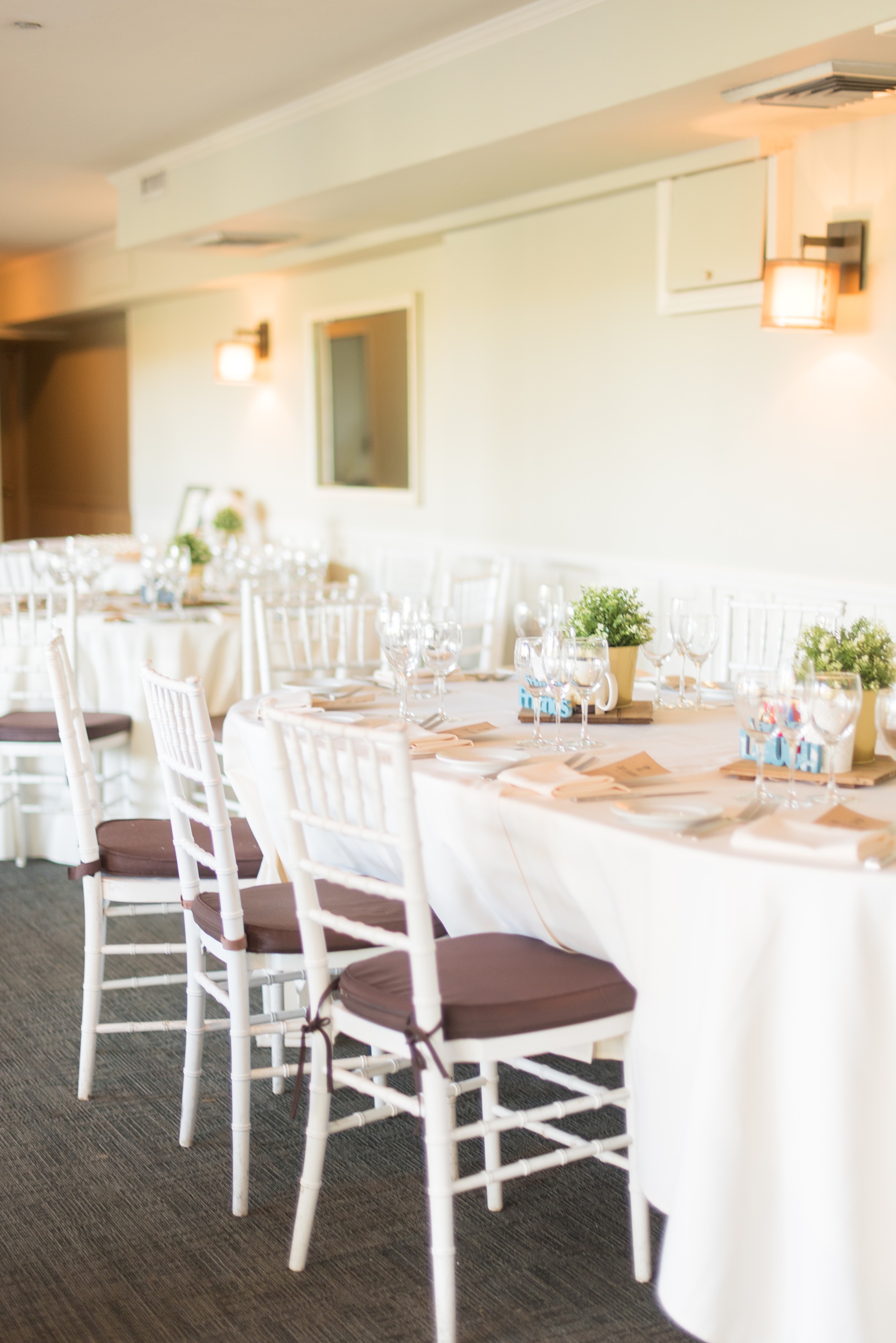 Mikkel Paige Photography photos of a wedding at Crabtree's Kittle House in Chappaqua, New York. Picture of the reception room with fall colors.