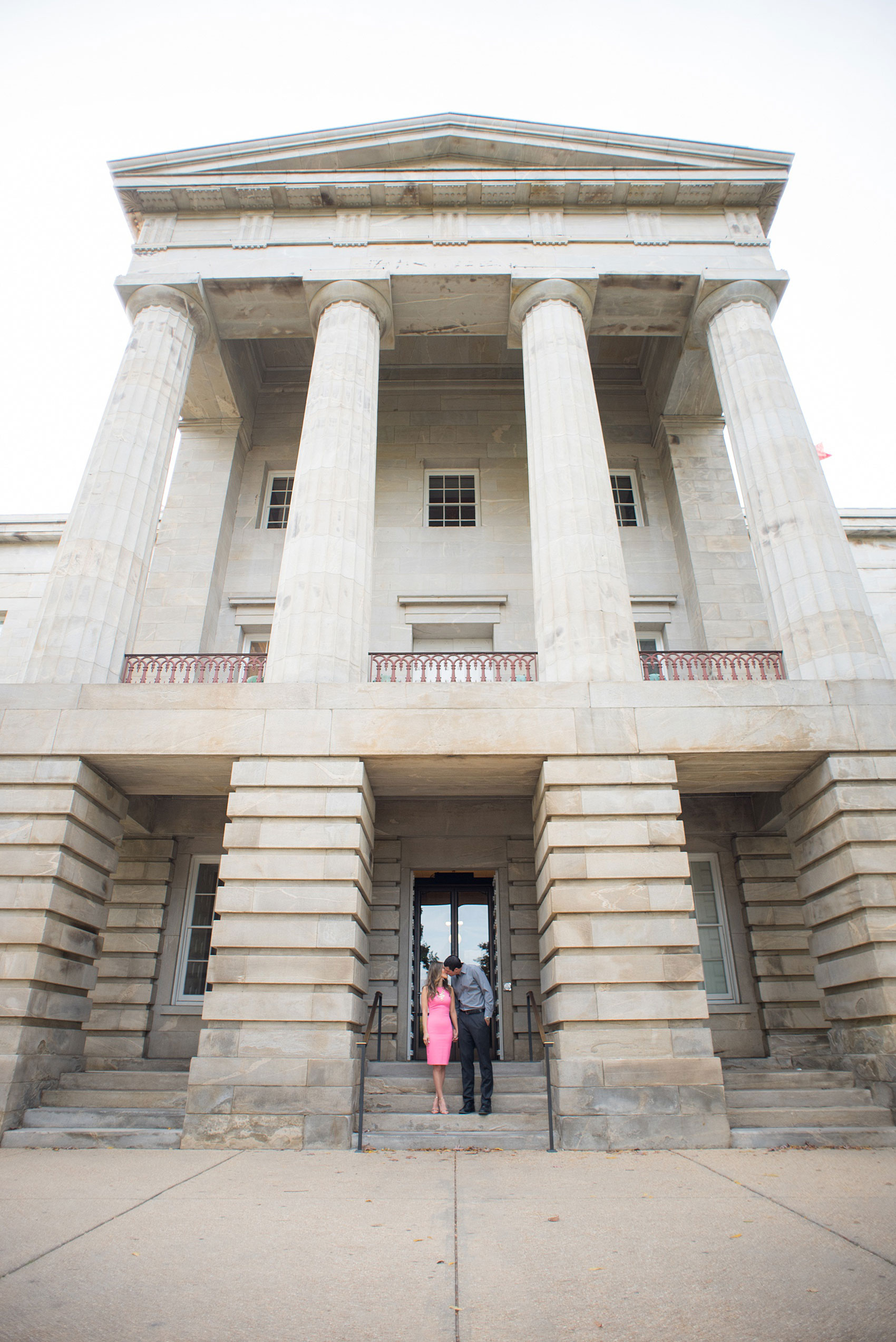 Colorful photos during a fall, autumn season engagement session. Grandiose architecture captured at the state capitol. Taken by Mikkel Paige Photography in an urban city setting. Click through to see more from this vibrant, unique photography session.