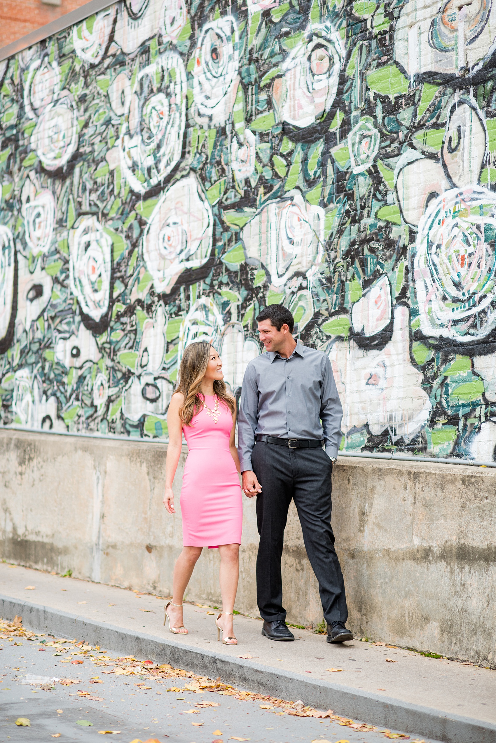 Colorful photos taken during a fall, autumn season engagement session. Images taken by Mikkel Paige Photography in an urban city setting. Click through to see more from this vibrant, unique photography session with lots of murals, street art and fun colors!