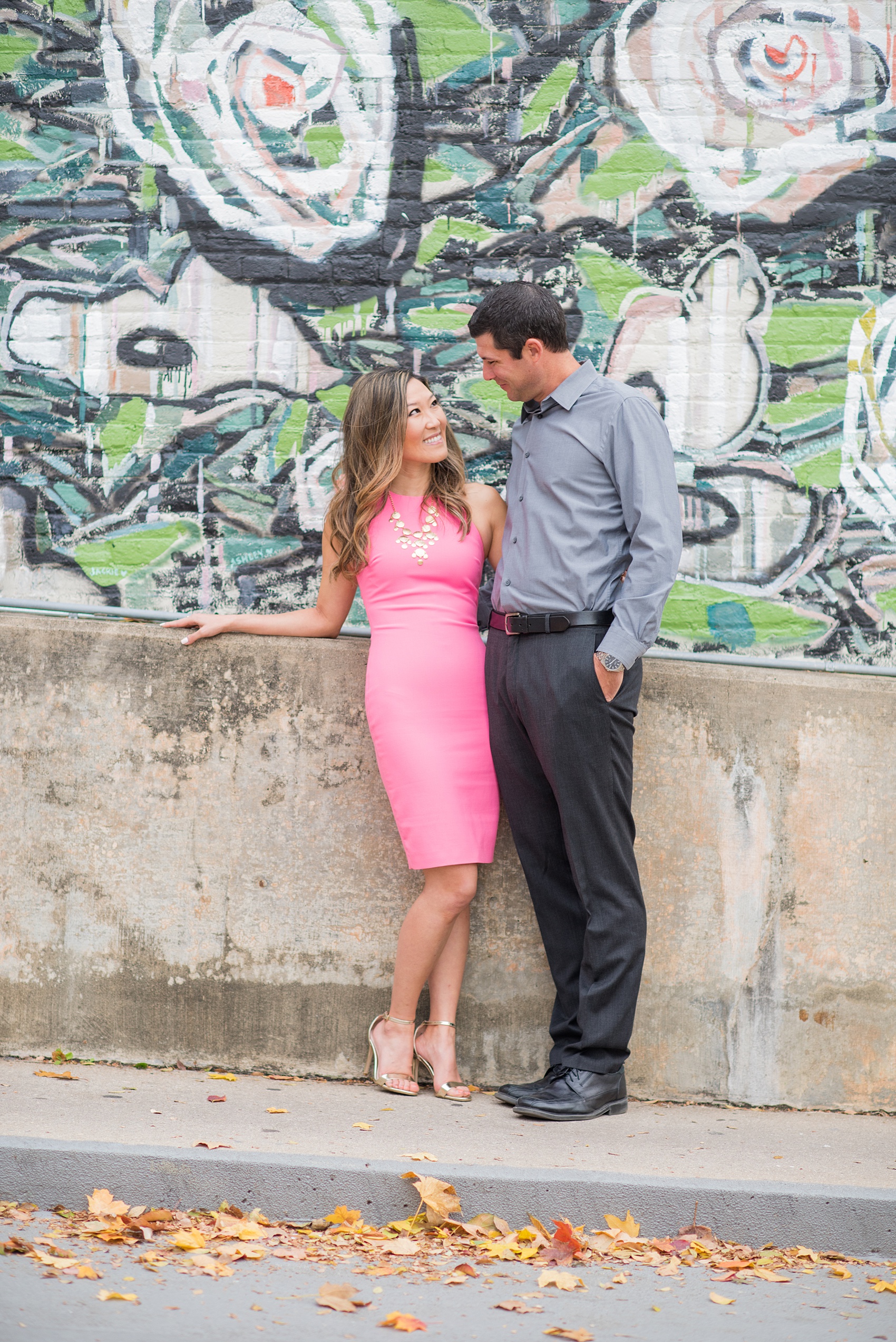 Colorful photos taken during a fall, autumn season engagement session. Images taken by Mikkel Paige Photography in an urban city setting. Click through to see more from this vibrant, unique photography session with lots of murals, street art and fun colors!