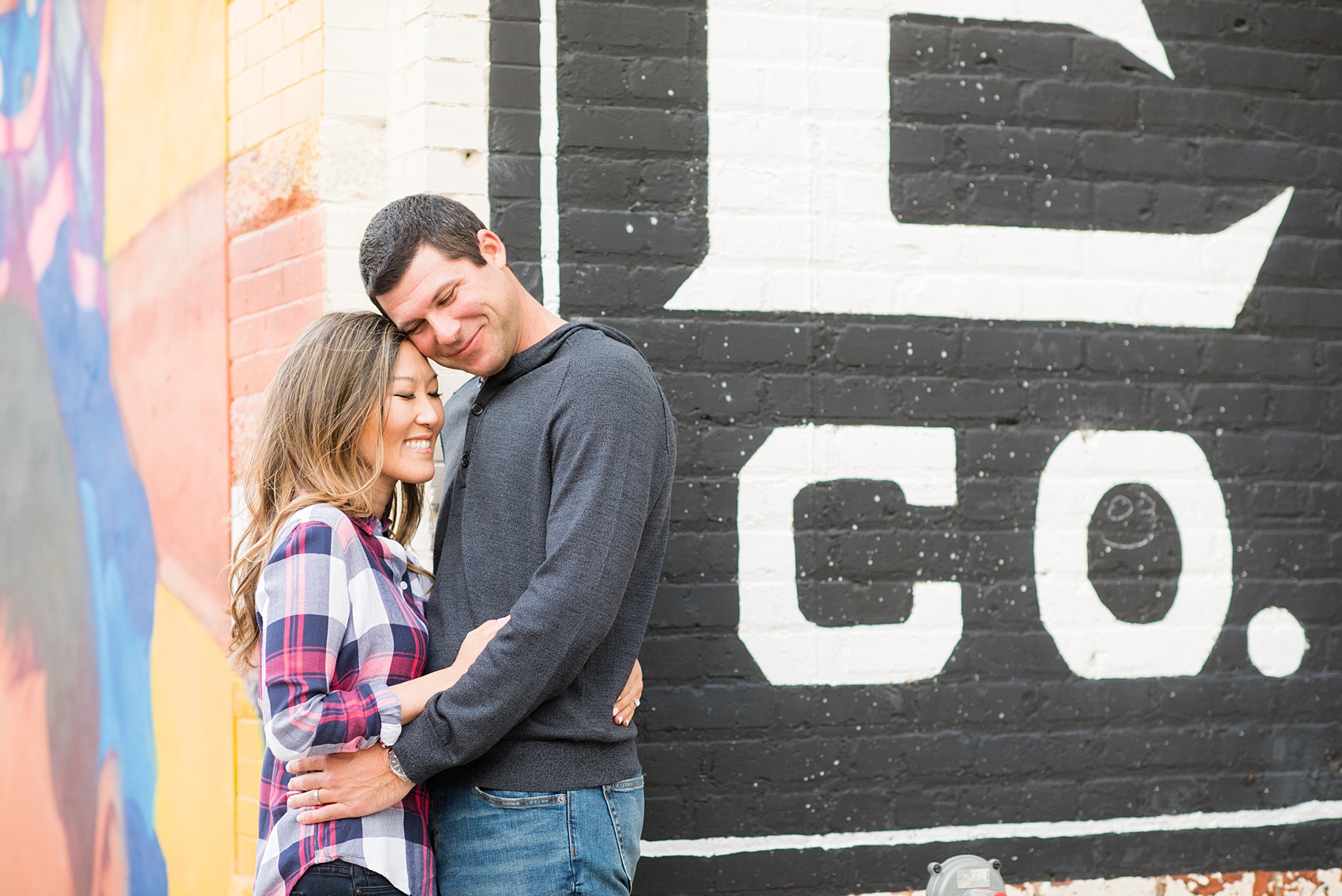 Colorful photos taken during a fall, autumn season engagement anniversary session. Images taken by Mikkel Paige Photography in an urban city setting. Click through to see more from this vibrant, unique photography session with lots of fun colors, street art murals and ideas for outfits!