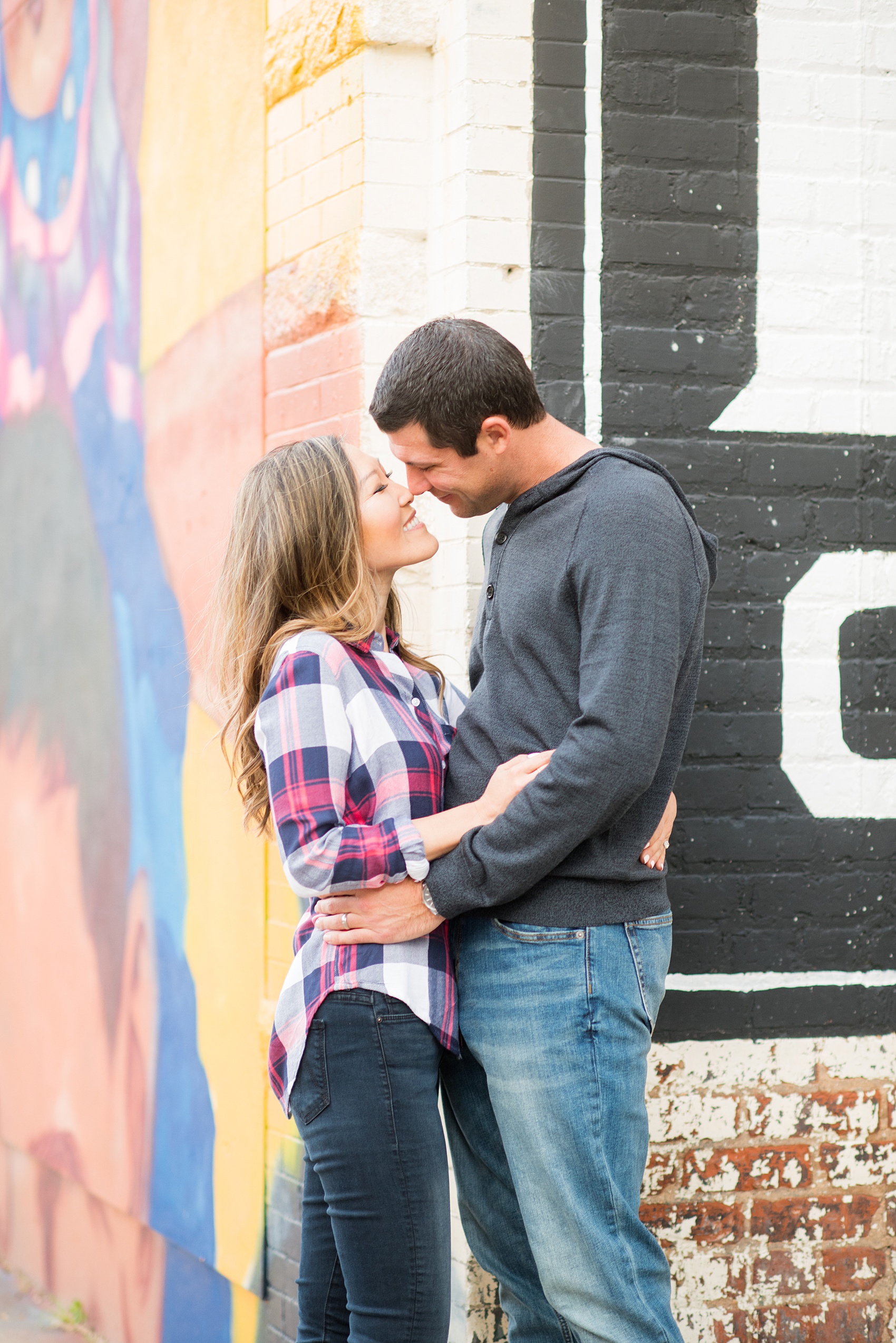 Colorful photos taken during a fall, autumn season engagement anniversary session. Images taken by Mikkel Paige Photography in an urban city setting. Click through to see more from this vibrant, unique photography session with lots of fun colors, street art murals and ideas for outfits!