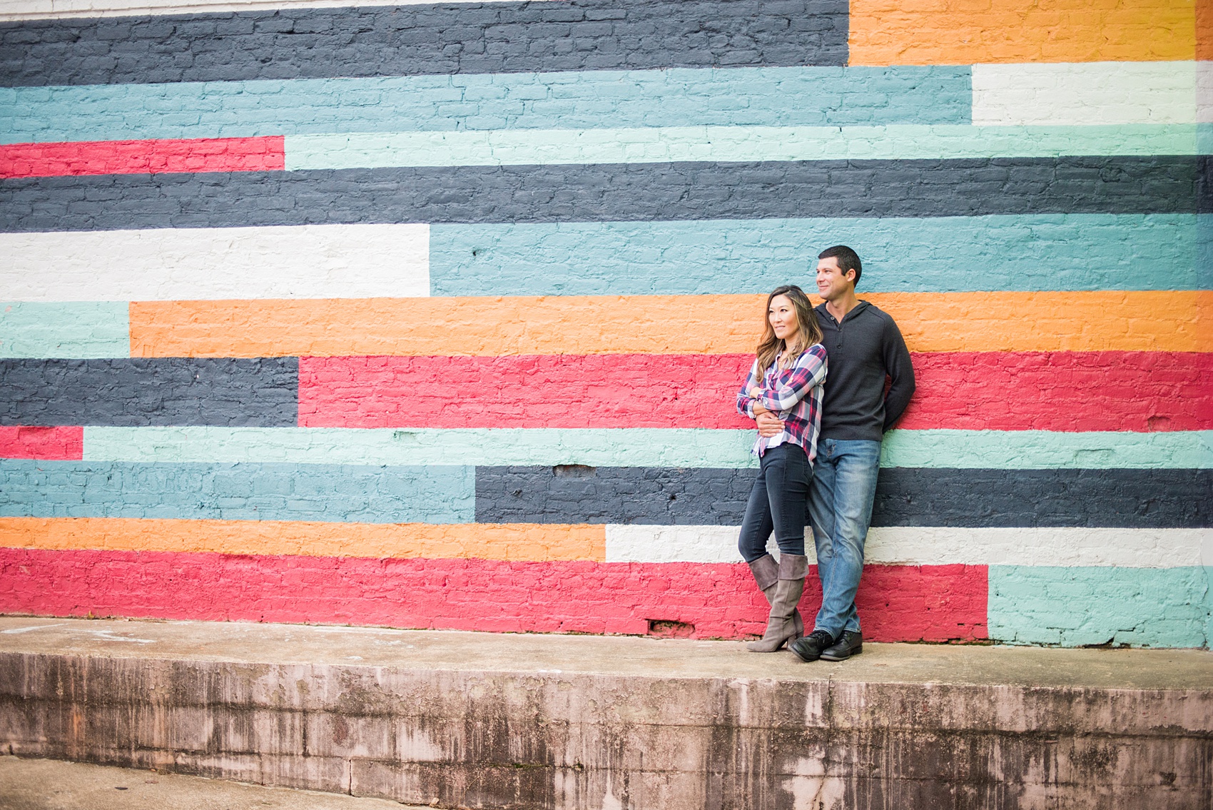 Colorful photos taken during a fall, autumn season engagement anniversary session. Images taken by Mikkel Paige Photography in an urban city setting. Click through to see more from this vibrant, unique photography session with lots of fun colors, street art murals and ideas for outfits!