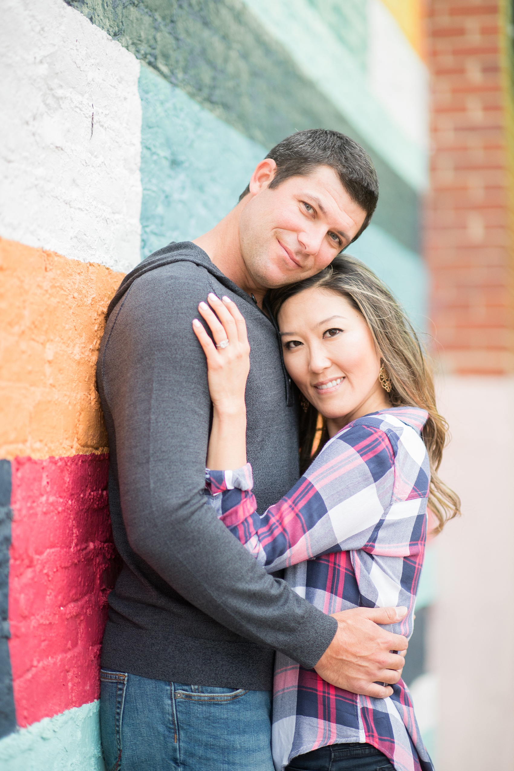 Colorful photos taken during a fall, autumn season engagement anniversary session. Images taken by Mikkel Paige Photography in an urban city setting. Click through to see more from this vibrant, unique photography session with lots of fun colors, street art murals and ideas for outfits!