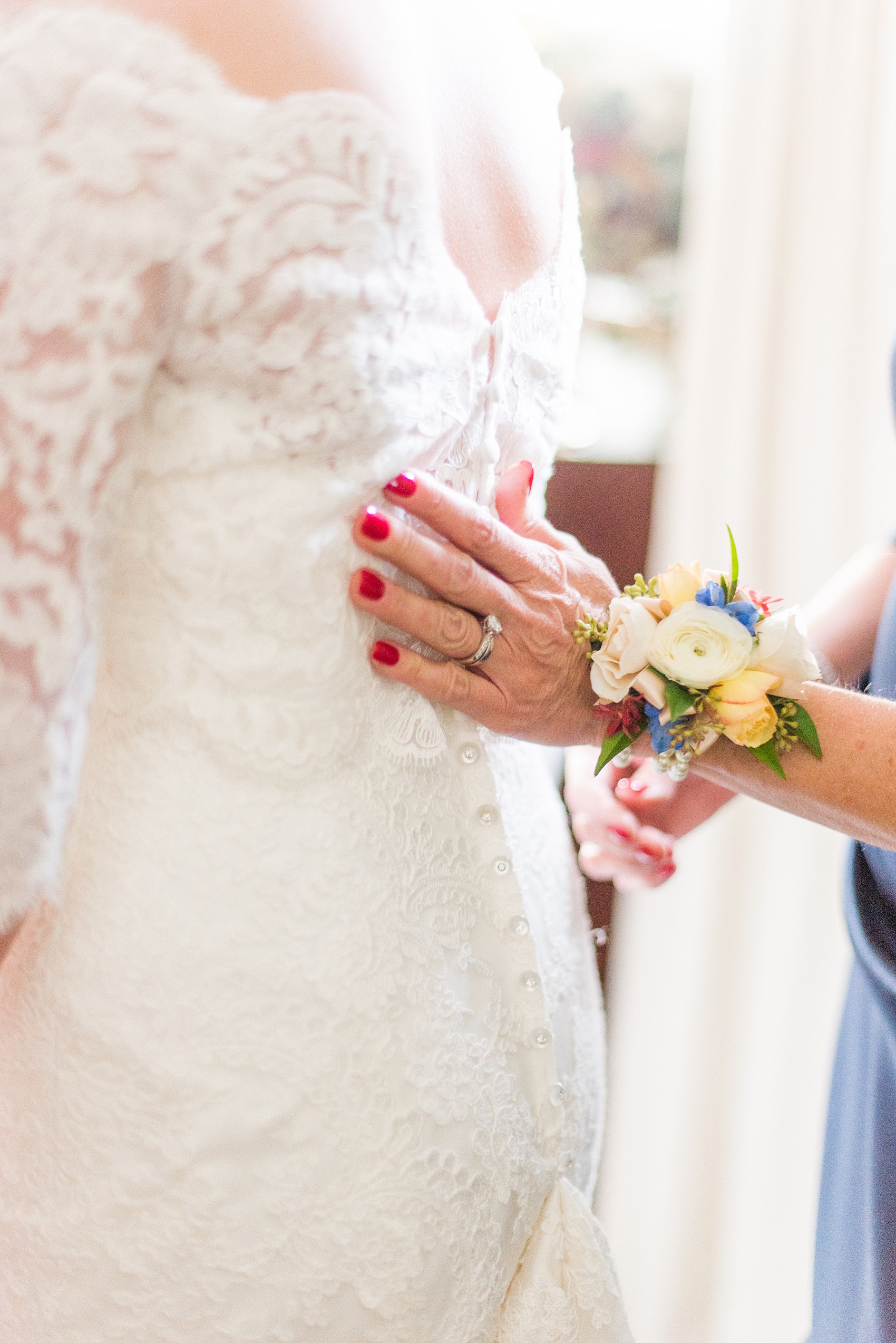 Beautiful wedding photos at The Carolina Inn at Chapel Hill, North Carolina by Mikkel Paige Photography. Photo of the bride's mother helping her get into her wedding gown - click through to see the rest of this gorgeous winter wedding! #thecarolinainn