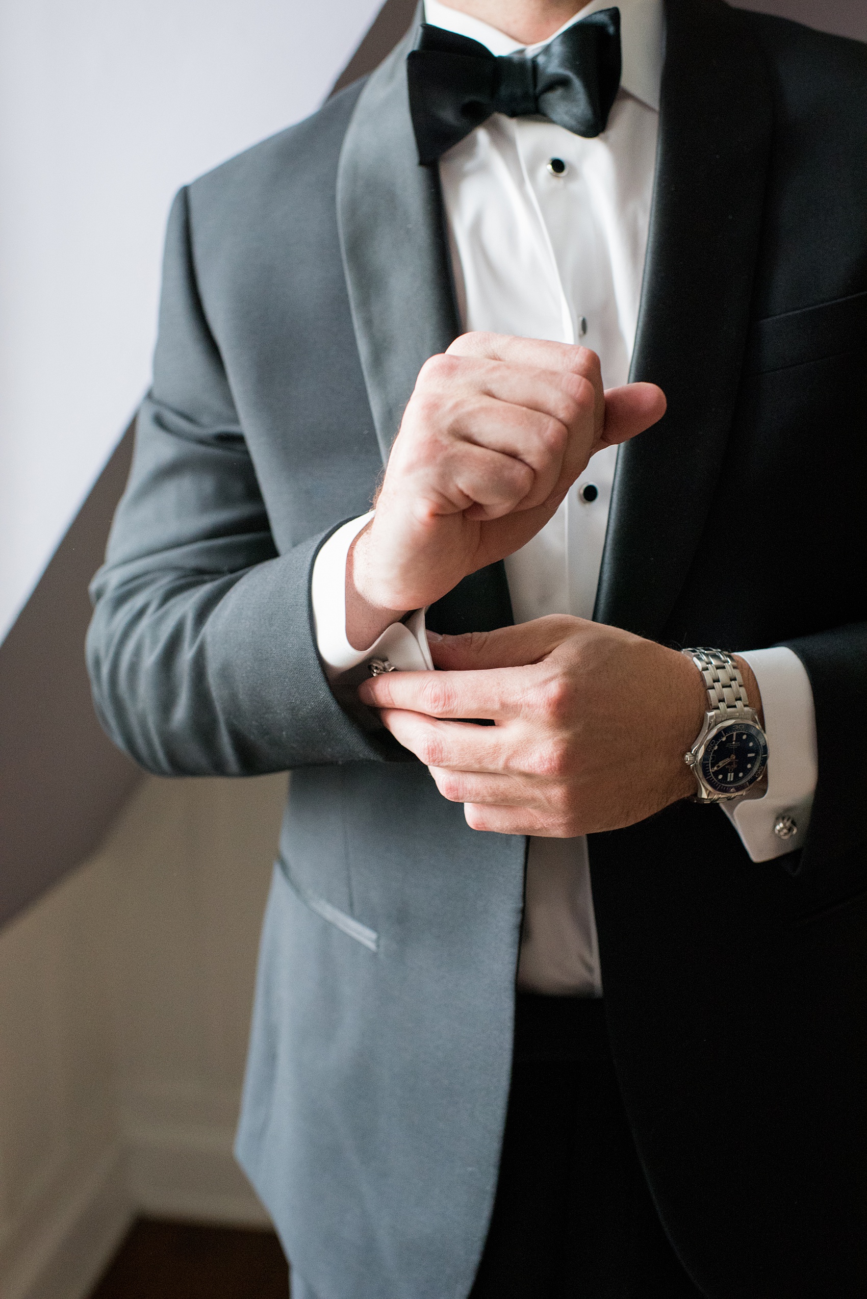 Beautiful wedding photos at The Carolina Inn at Chapel Hill, North Carolina by Mikkel Paige Photography. Detail photo of the groom getting ready. Click through to see the rest of this gorgeous winter wedding! #thecarolinainn #snowywedding