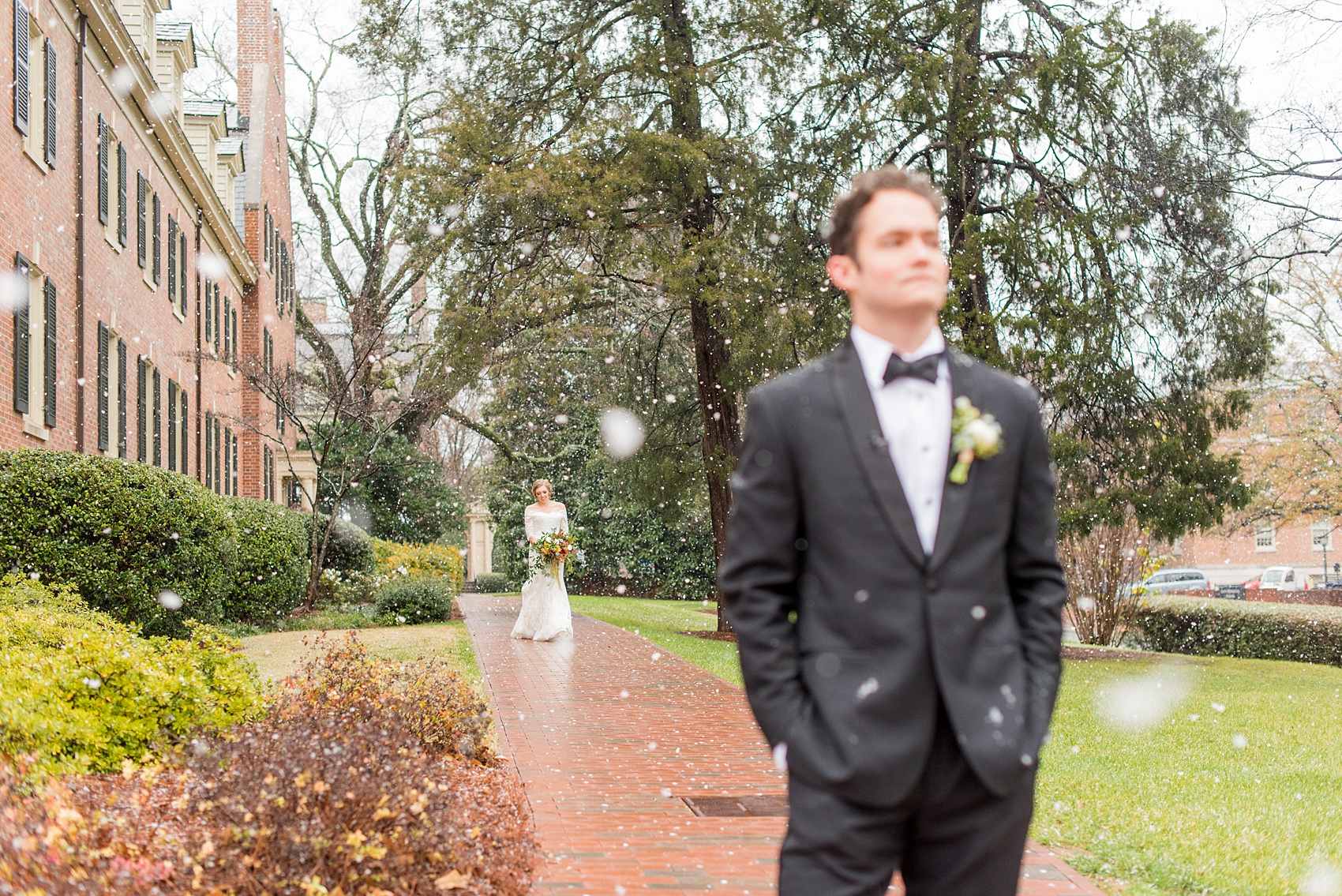 Beautiful wedding photos at The Carolina Inn at Chapel Hill, North Carolina by Mikkel Paige Photography. The bride walked through falling snow for their winter wonderland first look! Click through to see the rest of this gorgeous winter wedding! #thecarolinainn #snowywedding