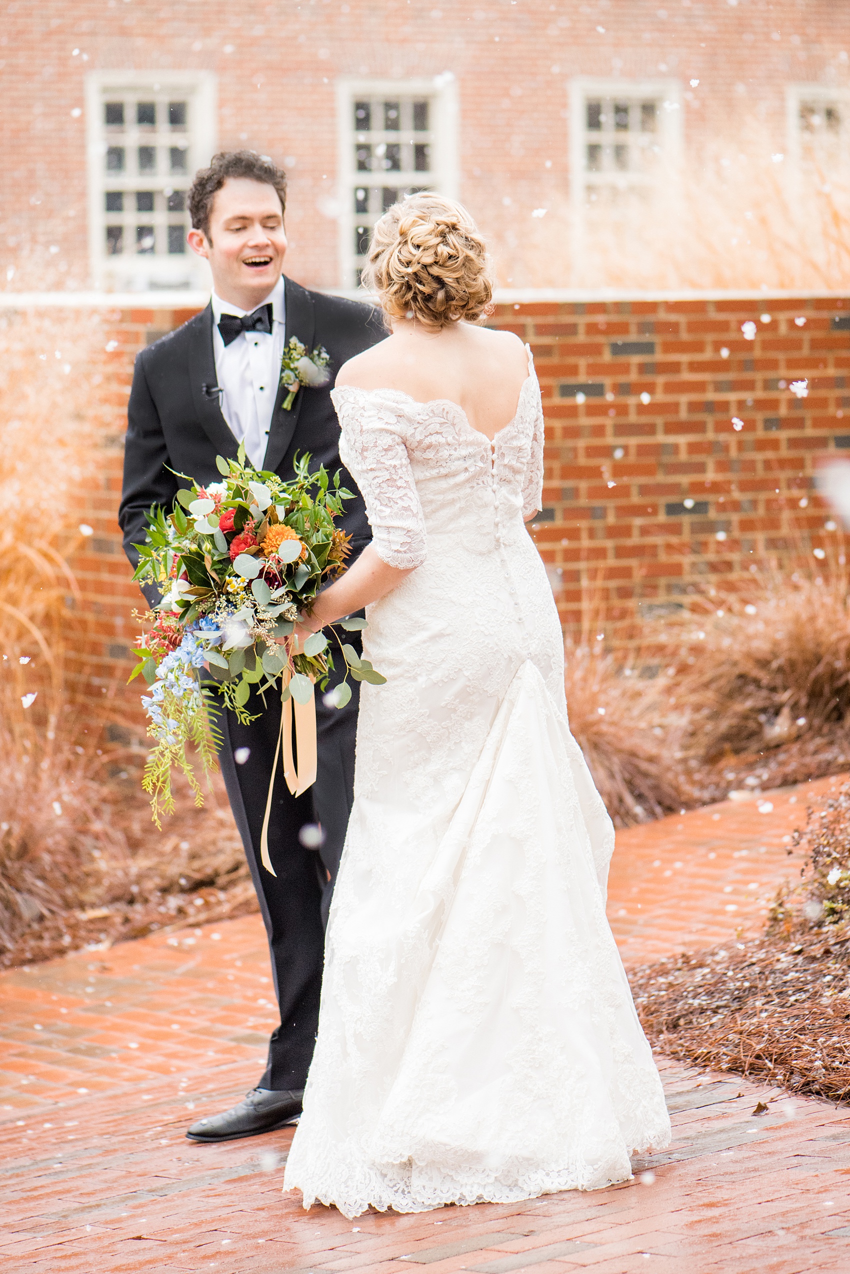 Beautiful wedding photos at The Carolina Inn at Chapel Hill, North Carolina by Mikkel Paige Photography. The bride walked through falling snow for their winter wonderland first look! Click through to see the rest of this gorgeous winter wedding! #thecarolinainn #snowywedding