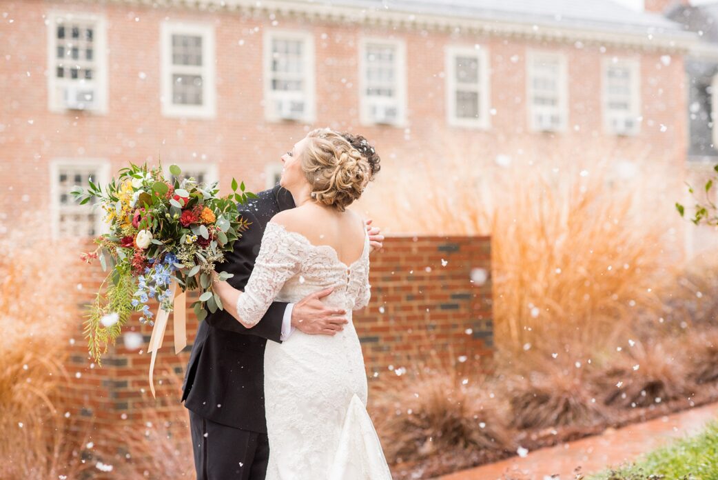 Beautiful wedding photos at The Carolina Inn at Chapel Hill, North Carolina by Mikkel Paige Photography. The bride walked through falling snow for their winter wonderland first look! Click through to see the rest of this gorgeous winter wedding! #thecarolinainn #snowywedding