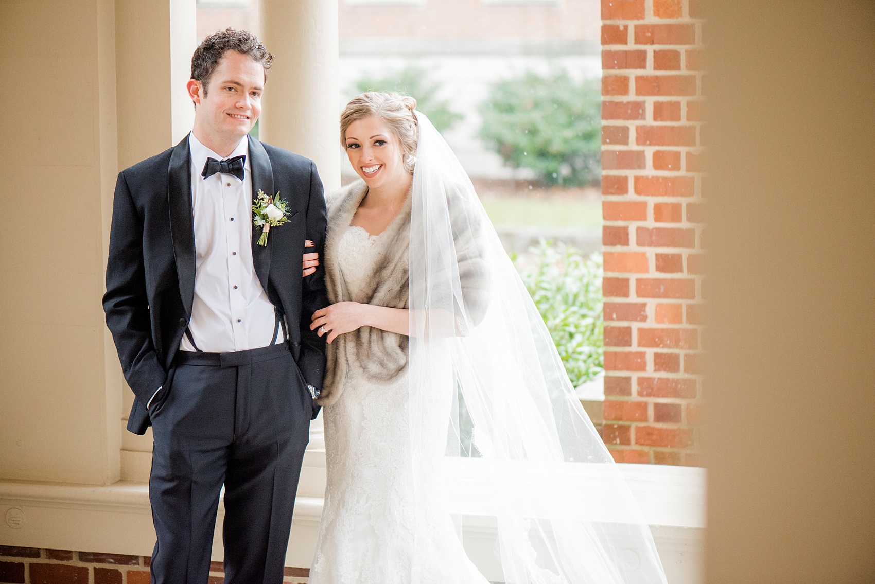 Beautiful wedding photos at The Carolina Inn at Chapel Hill, North Carolina by Mikkel Paige Photography. Photo of the bride in her heirloom fur shawl and veil. #thecarolinainn #snowywedding