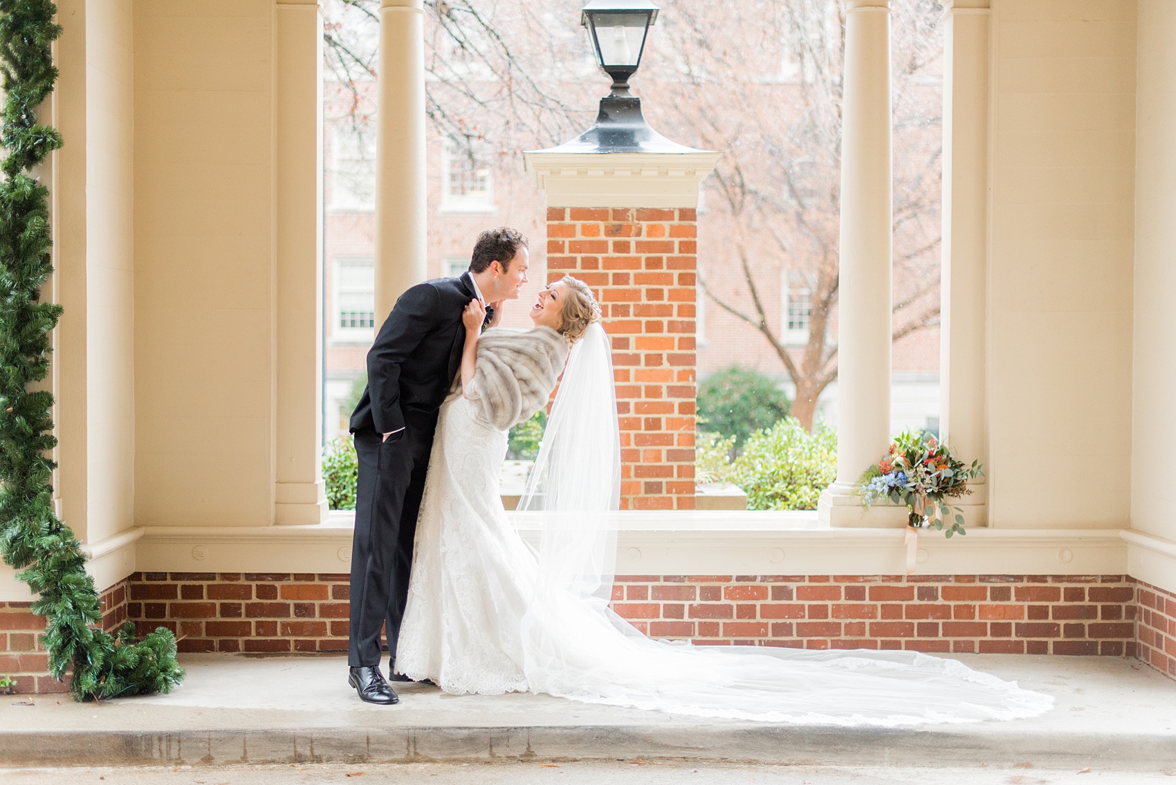 Beautiful wedding photos at The Carolina Inn at Chapel Hill, North Carolina by Mikkel Paige Photography. Photo of the bride in her heirloom fur shawl and veil. #thecarolinainn #snowywedding