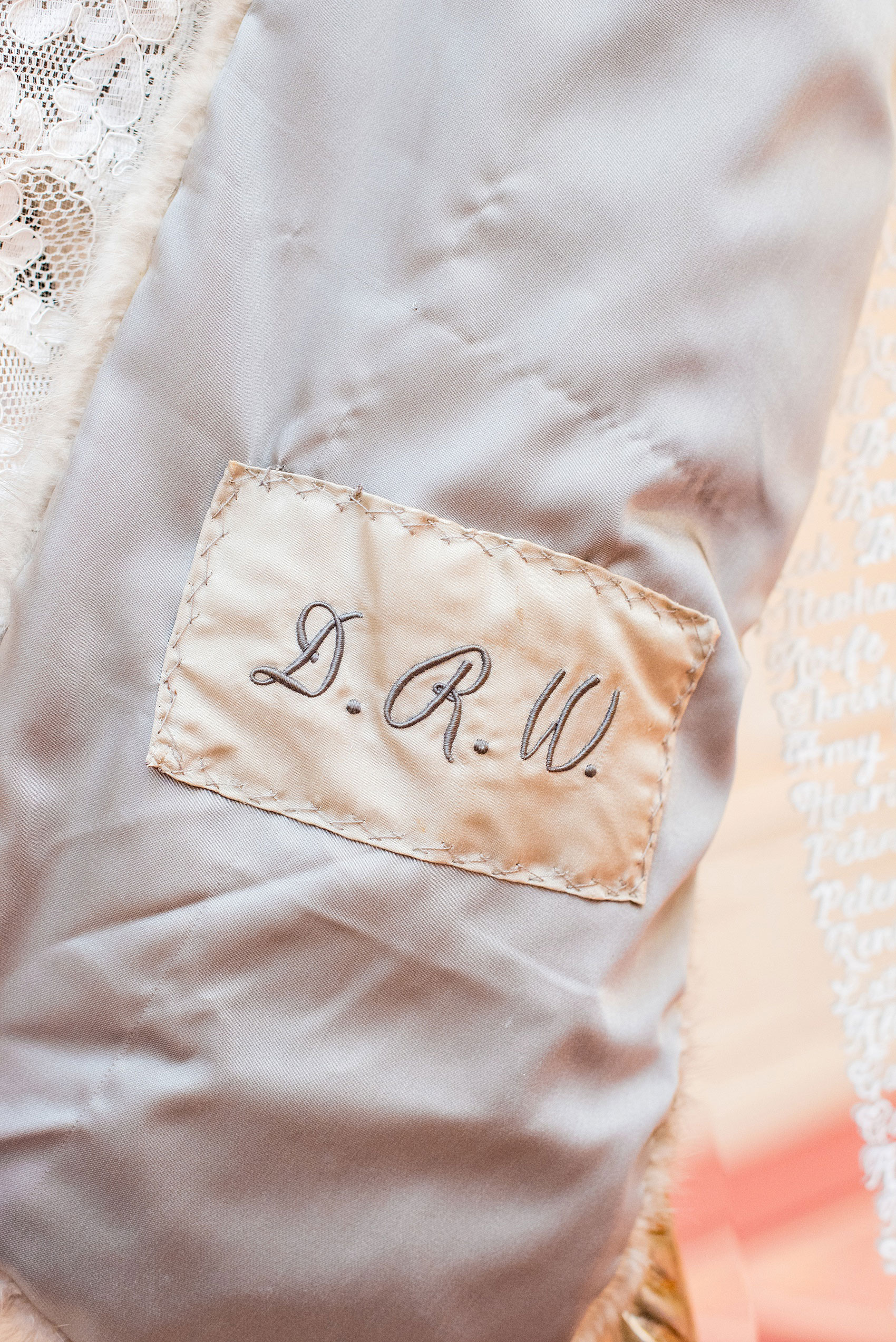 Beautiful wedding photos at The Carolina Inn at Chapel Hill, North Carolina by Mikkel Paige Photography. Photo of the bride's grandmother's initials in her heirloom fur shawl. #thecarolinainn #snowywedding