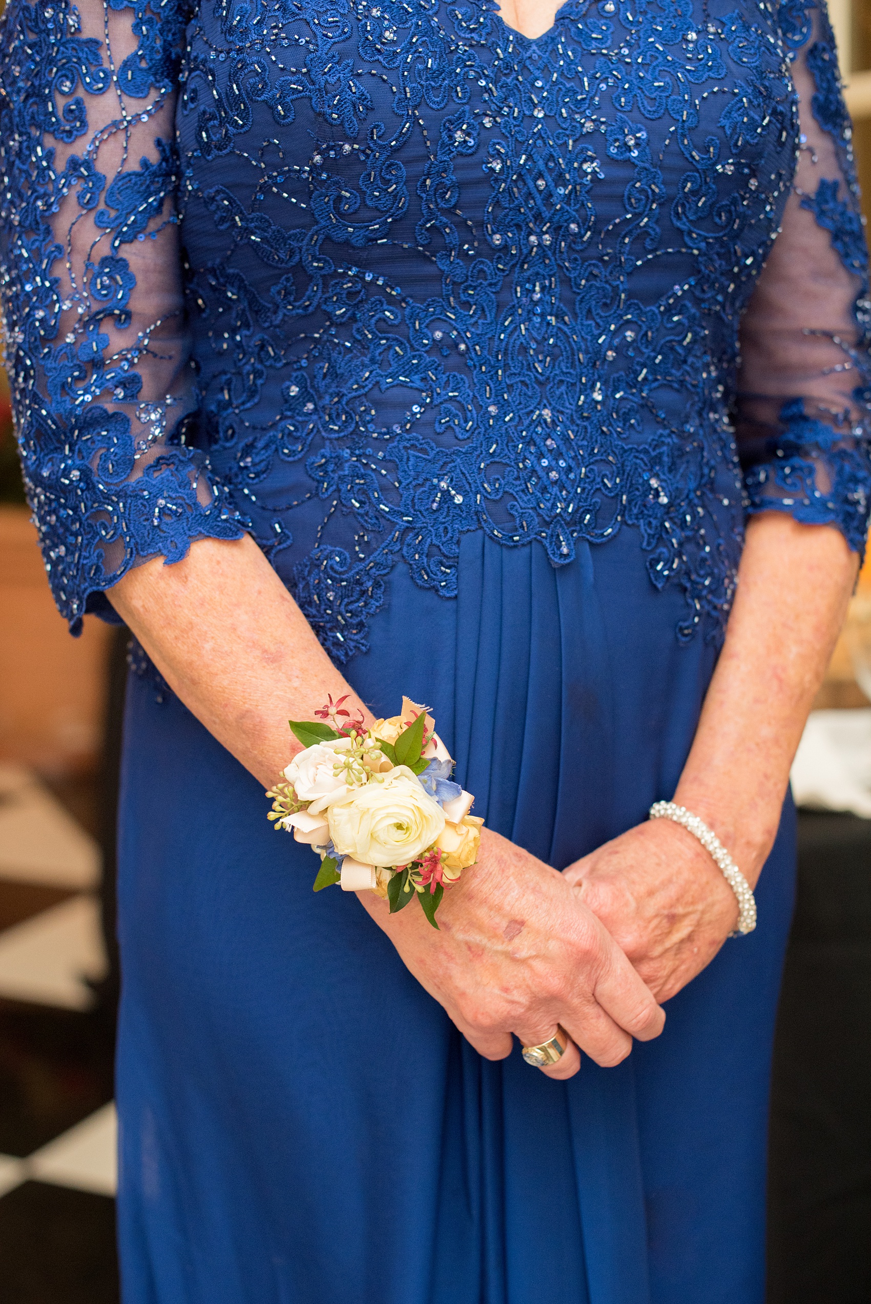 Beautiful wedding photos at The Carolina Inn at Chapel Hill, North Carolina by Mikkel Paige Photography. Photo of the mother of the groom floral corsage by English Garden. Click through to see the rest of this gorgeous winter wedding! #thecarolinainn #snowywedding