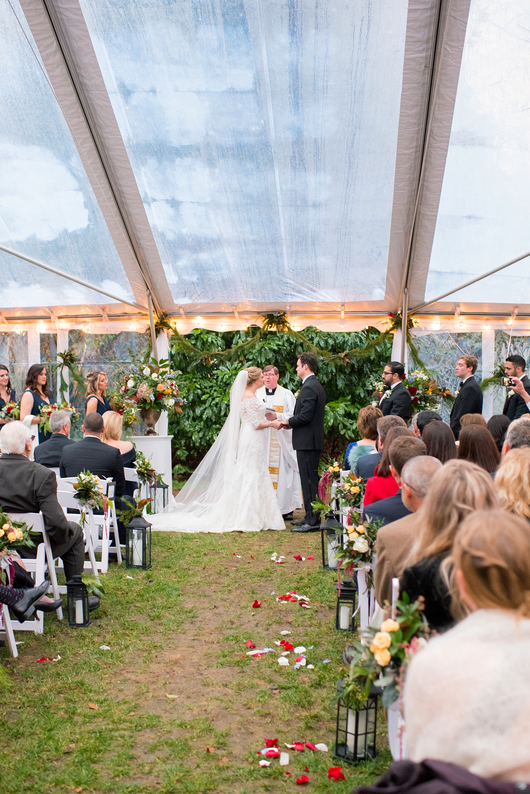 Beautiful wedding photos at The Carolina Inn at Chapel Hill, North Carolina by Mikkel Paige Photography. Picture of the outdoor ceremony under a clear tent. Click through to see the rest of this gorgeous winter wedding! #thecarolinainn #snowywedding