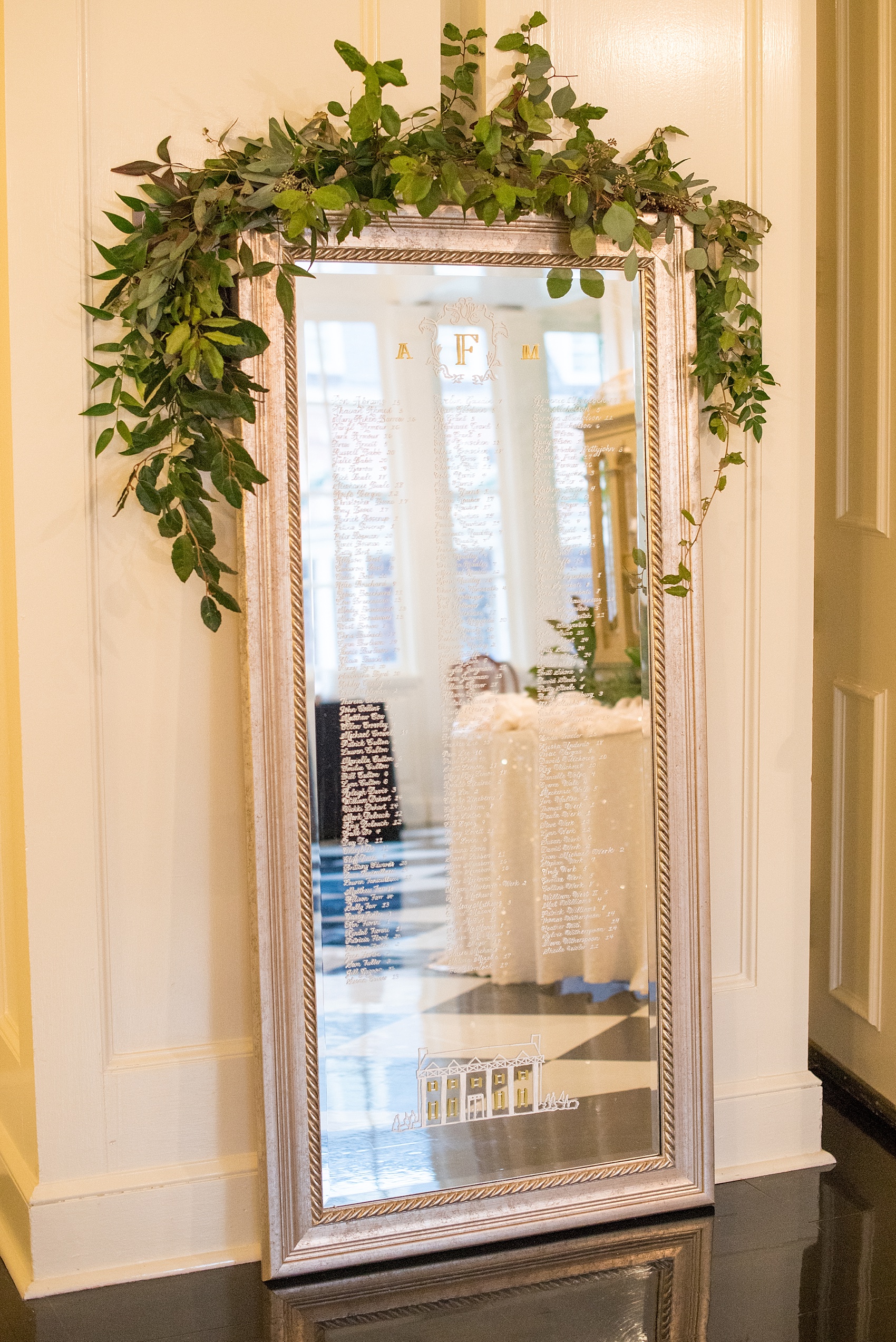 Beautiful wedding photos at The Carolina Inn at Chapel Hill, North Carolina by Mikkel Paige Photography. Mirror seating chart sign with calligraphy created by Mason Dixon Designs. Click through to see the rest of this gorgeous winter wedding! #thecarolinainn #snowywedding