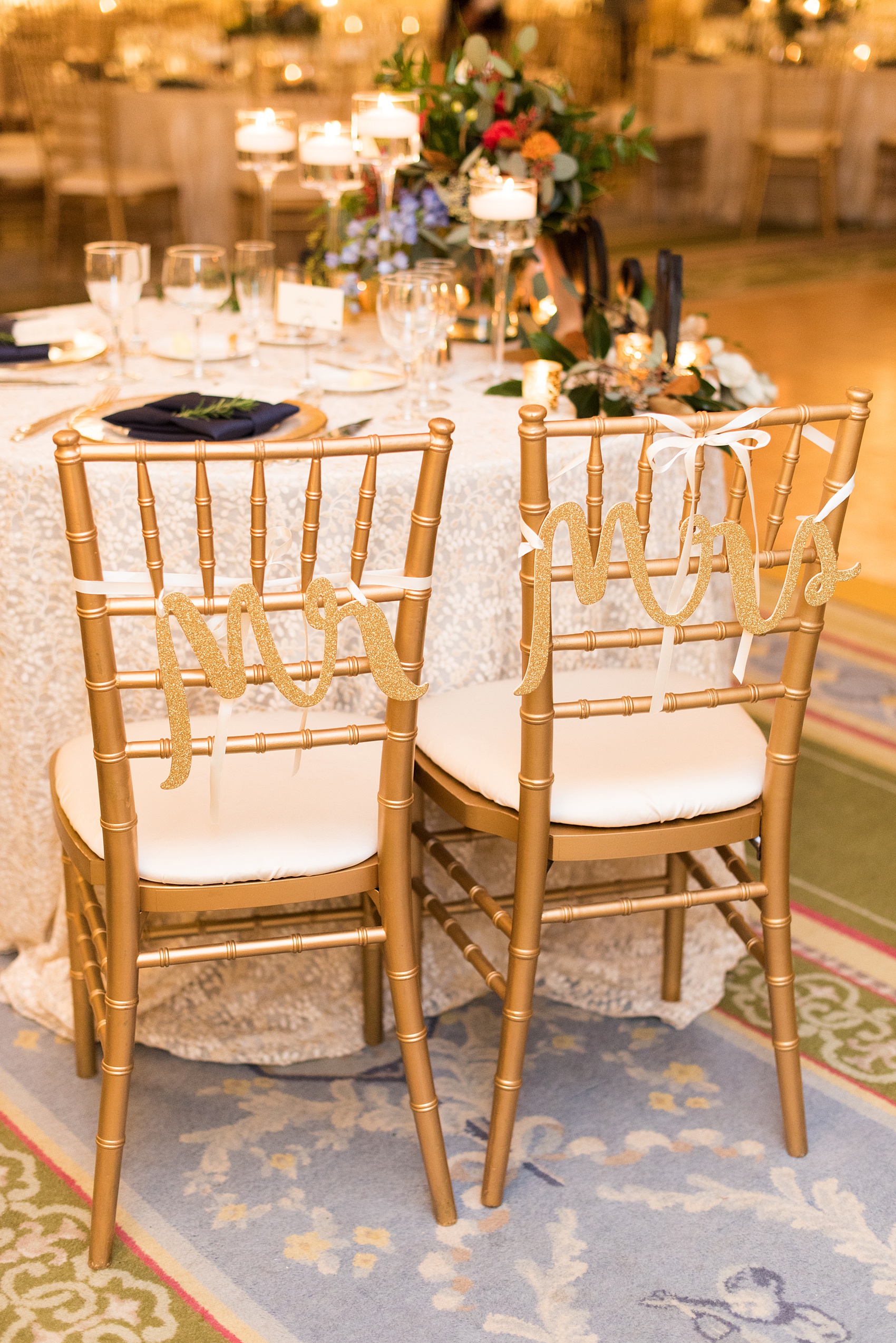 Beautiful wedding photos at The Carolina Inn at Chapel Hill, North Carolina by Mikkel Paige Photography. Picture of the gold glitter Mr. and Mrs. signs on the backs of the bride and groom chairs. Click through to see the rest of this gorgeous winter wedding! #thecarolinainn #snowywedding