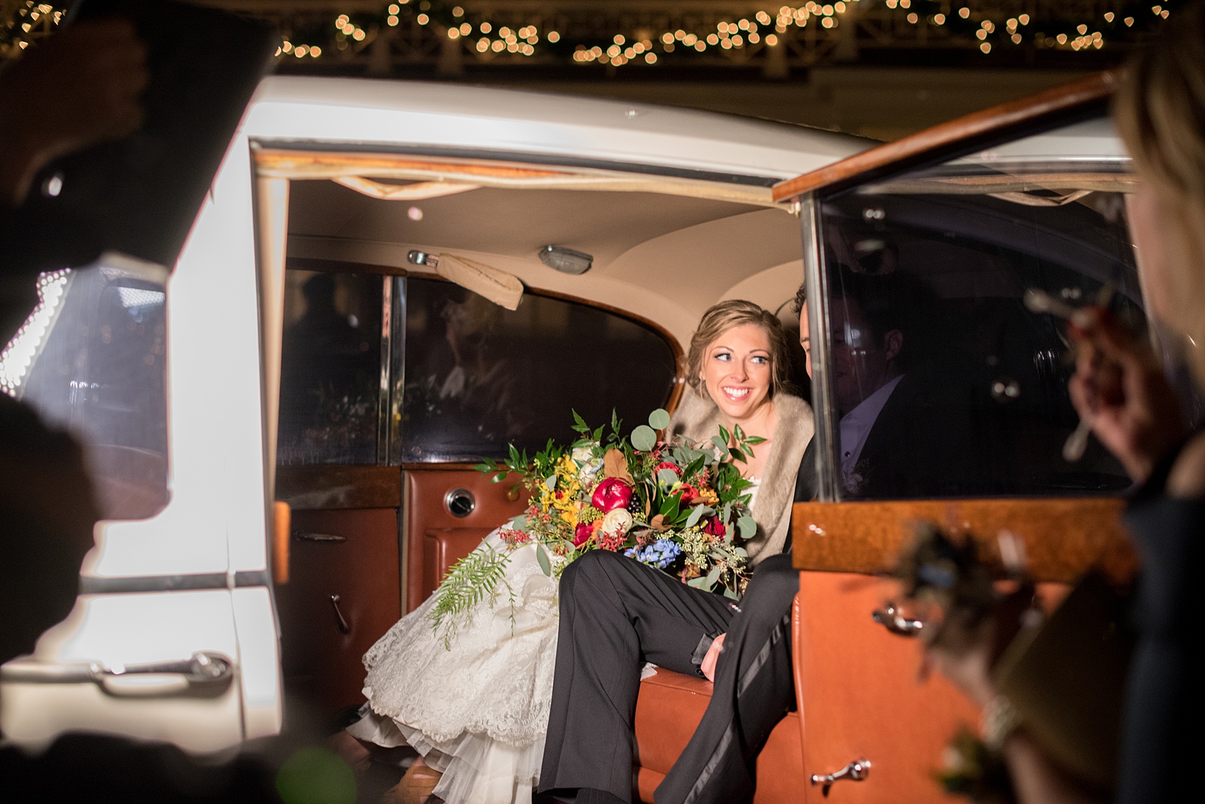 Beautiful wedding photos at The Carolina Inn at Chapel Hill, North Carolina by Mikkel Paige Photography. Picture of the bride and groom leaving their reception in a vintage white Rolls Royce. Planning by McLean Events. Click through to see the rest of this gorgeous winter wedding! #thecarolinainn #snowywedding