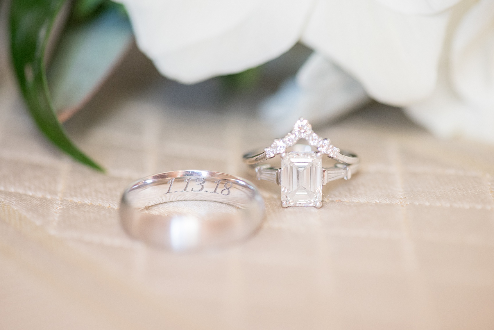 Winter wedding photos at Sleepy Hollow Country Club, New York about an hour from NYC, by Mikkel Paige Photography. Detail picture of their wedding rings - the bride had a unique pointed diamond band and emerald cut engagement ring. The groom's white gold band had their date engraved. #winterwedding #NYweddingphotos #SleepyHollowNY