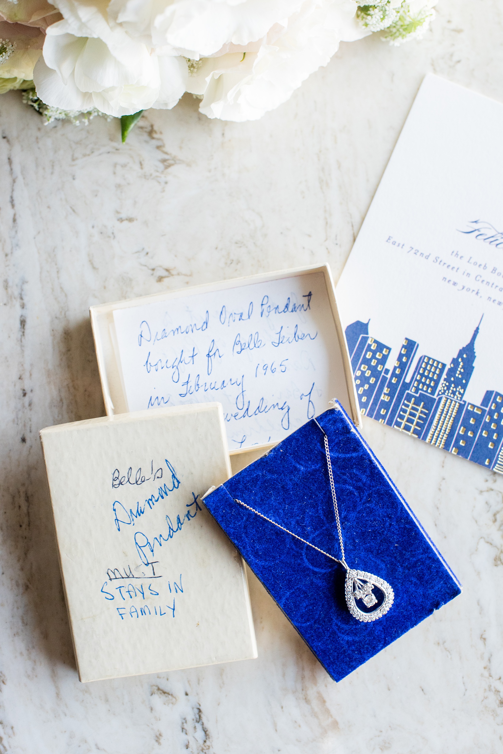 Photos by Mikkel Paige Photography of a Central Park Wedding ceremony and reception at the Loeb Boathouse venue with a romantic theme. This detail picture of the bride's necklace shows the heirloom jewelry passed from generations. Click through for more images from her day! #CentralParkWedding