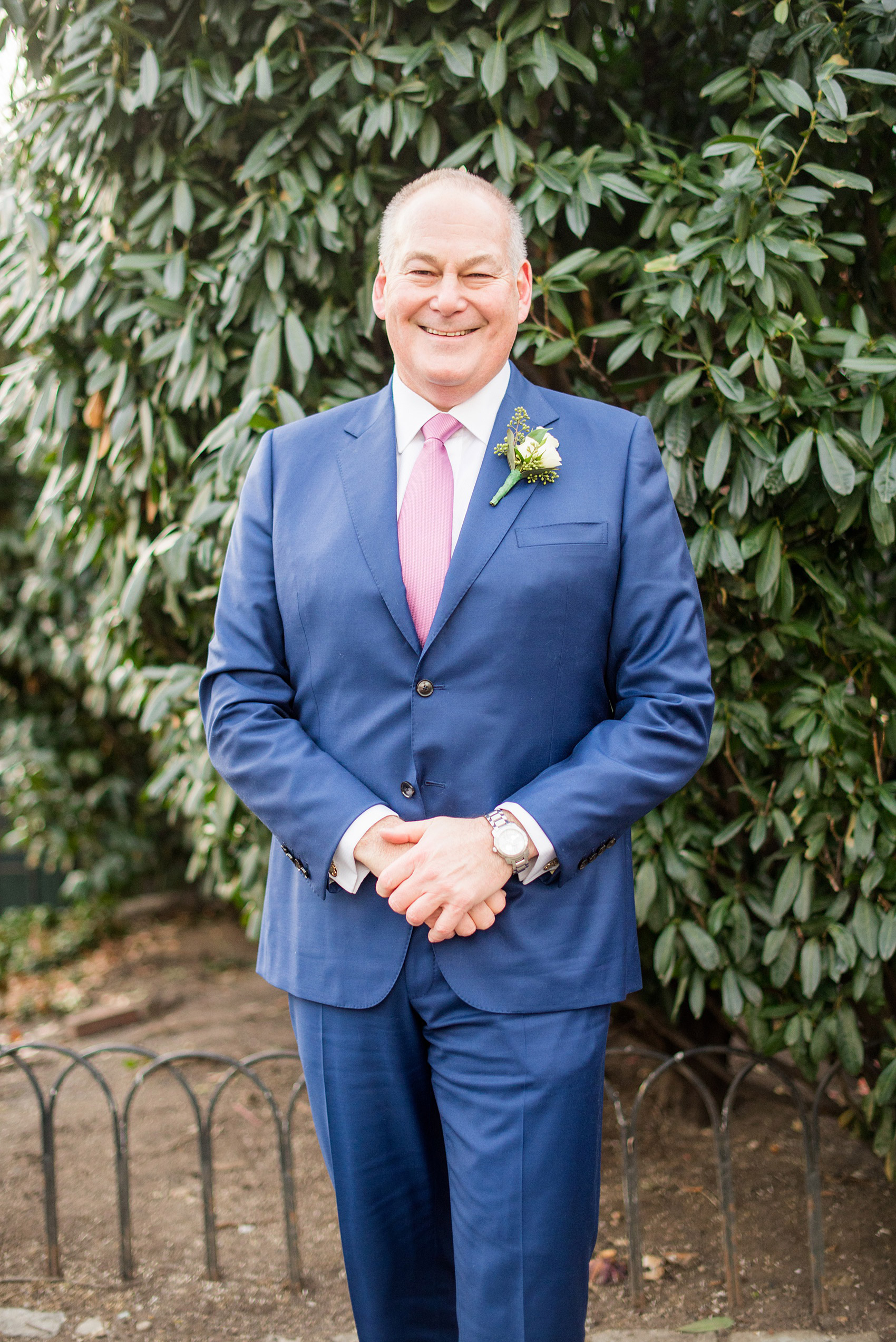 Photos by Mikkel Paige Photography of a Central Park Wedding ceremony and reception at the Loeb Boathouse venue with a romantic theme. A picture of the groom in his custom navy blue suit during their winter wedding. Click through for more images from their day! #CentralParkWedding