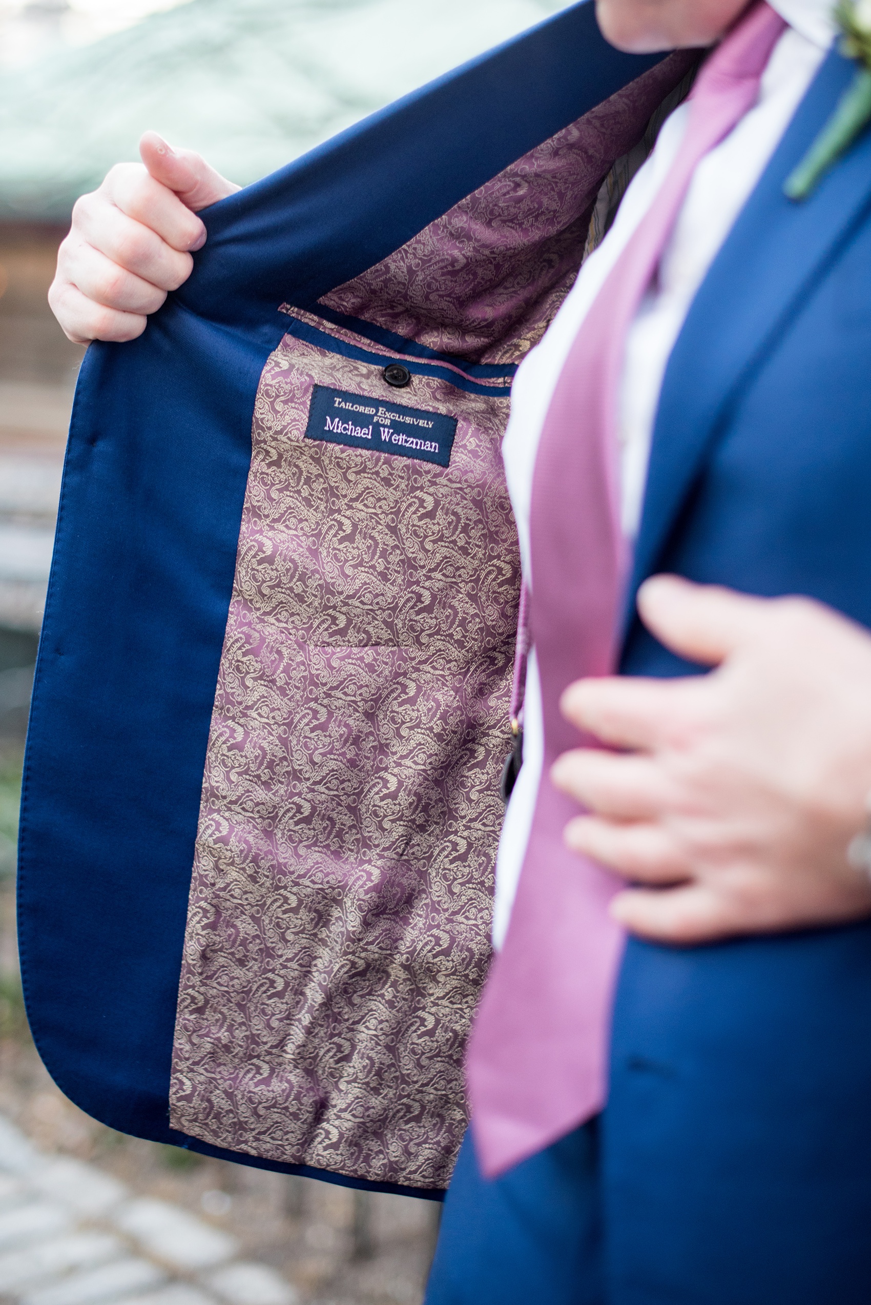 Photos by Mikkel Paige Photography of a Central Park Wedding ceremony and reception at the Loeb Boathouse venue with a romantic winter theme. A picture of the groom's custom lining for a special navy blue suit. Click through for more images from their day! #CentralParkWedding