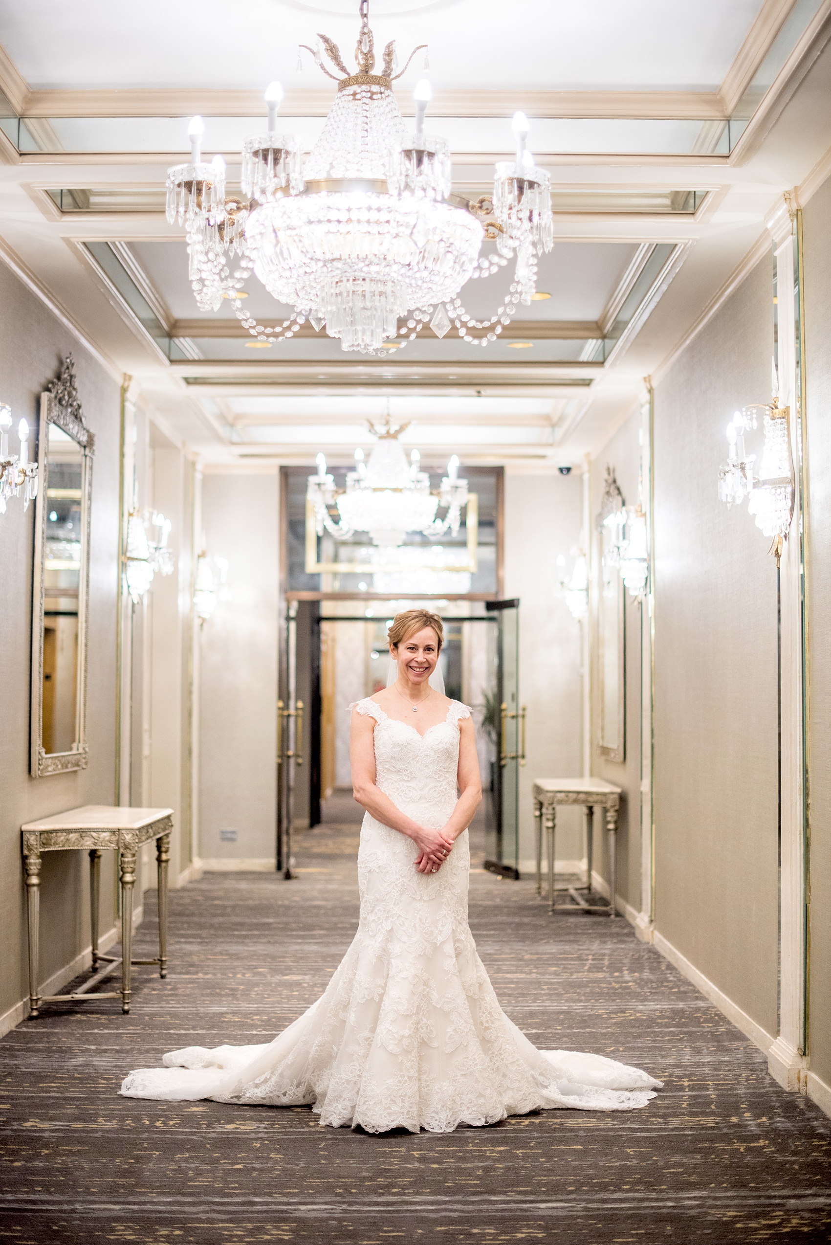 Photos by Mikkel Paige Photography of a Central Park Wedding ceremony and reception at the Loeb Boathouse venue with a romantic theme. Picture of the bride inside the Park Lane Hotel before her first look with her groom. Click through for more images from their winter wedding day! #CentralParkWedding