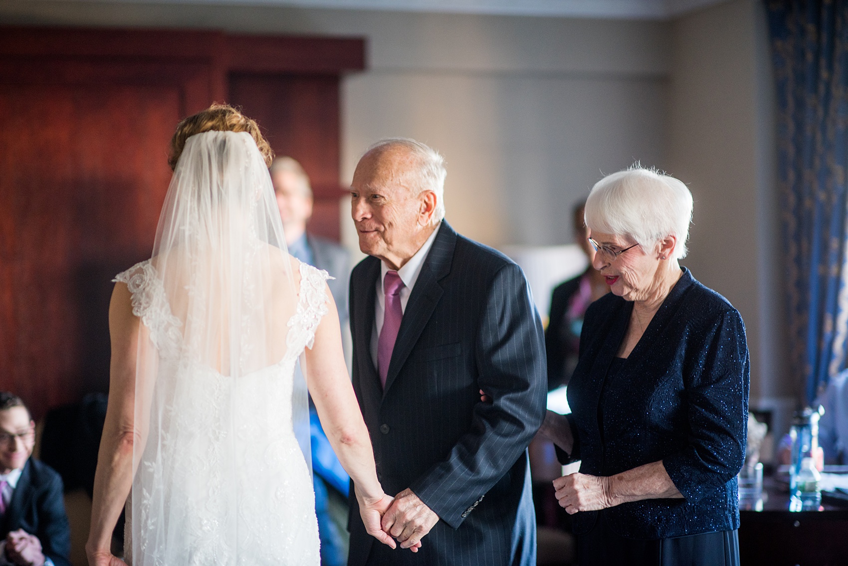 Photos by Mikkel Paige Photography of a Central Park Wedding ceremony and reception at the Loeb Boathouse venue with a romantic theme. Picture of the father of the bride seeing her for the first time that winter day inside the Park Lane Hotel before her first look with her groom. Click through for more images from their winter wedding day! #CentralParkWedding