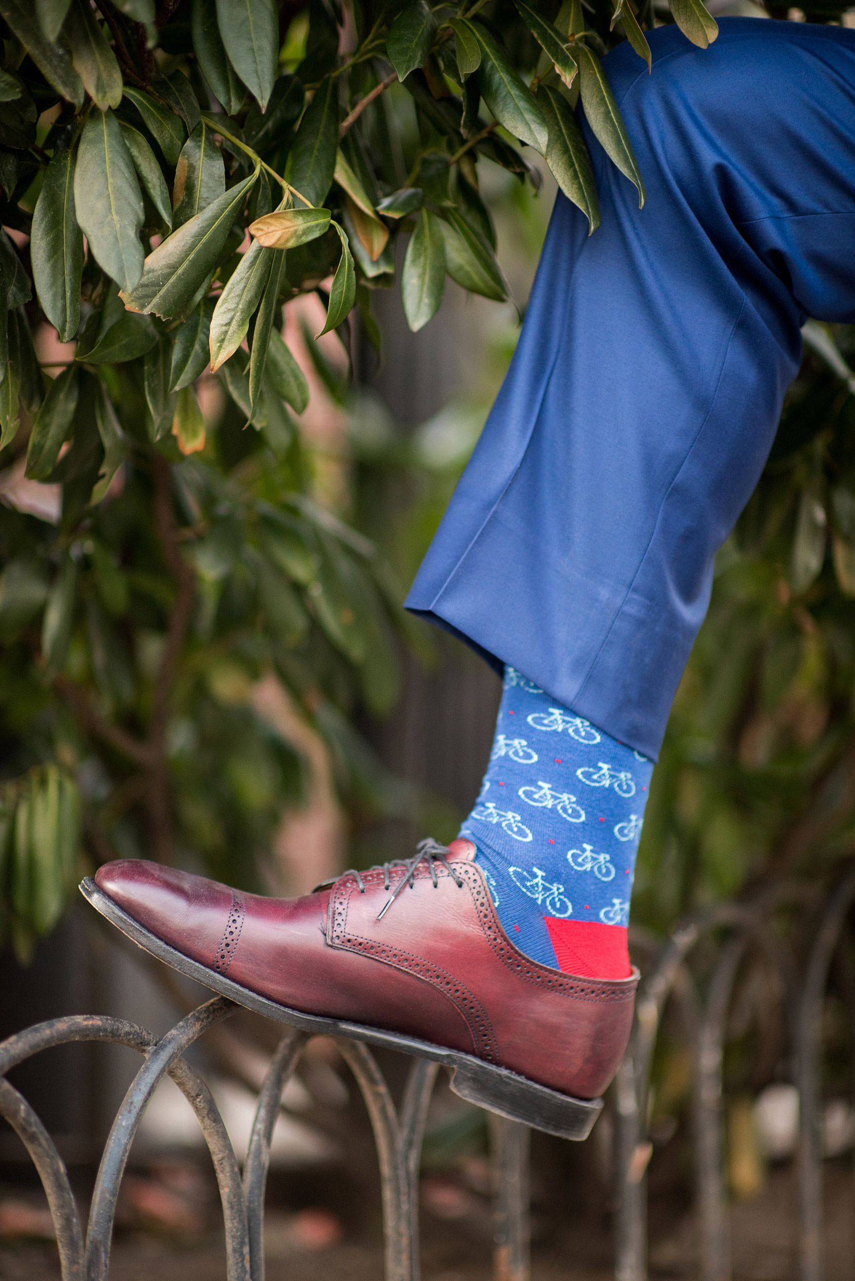 Photos by Mikkel Paige Photography of a Central Park Wedding ceremony and reception at the Loeb Boathouse venue with a romantic winter theme. A picture of the groom's bicycle themed socks. Click through for more images from their day! #CentralParkWedding