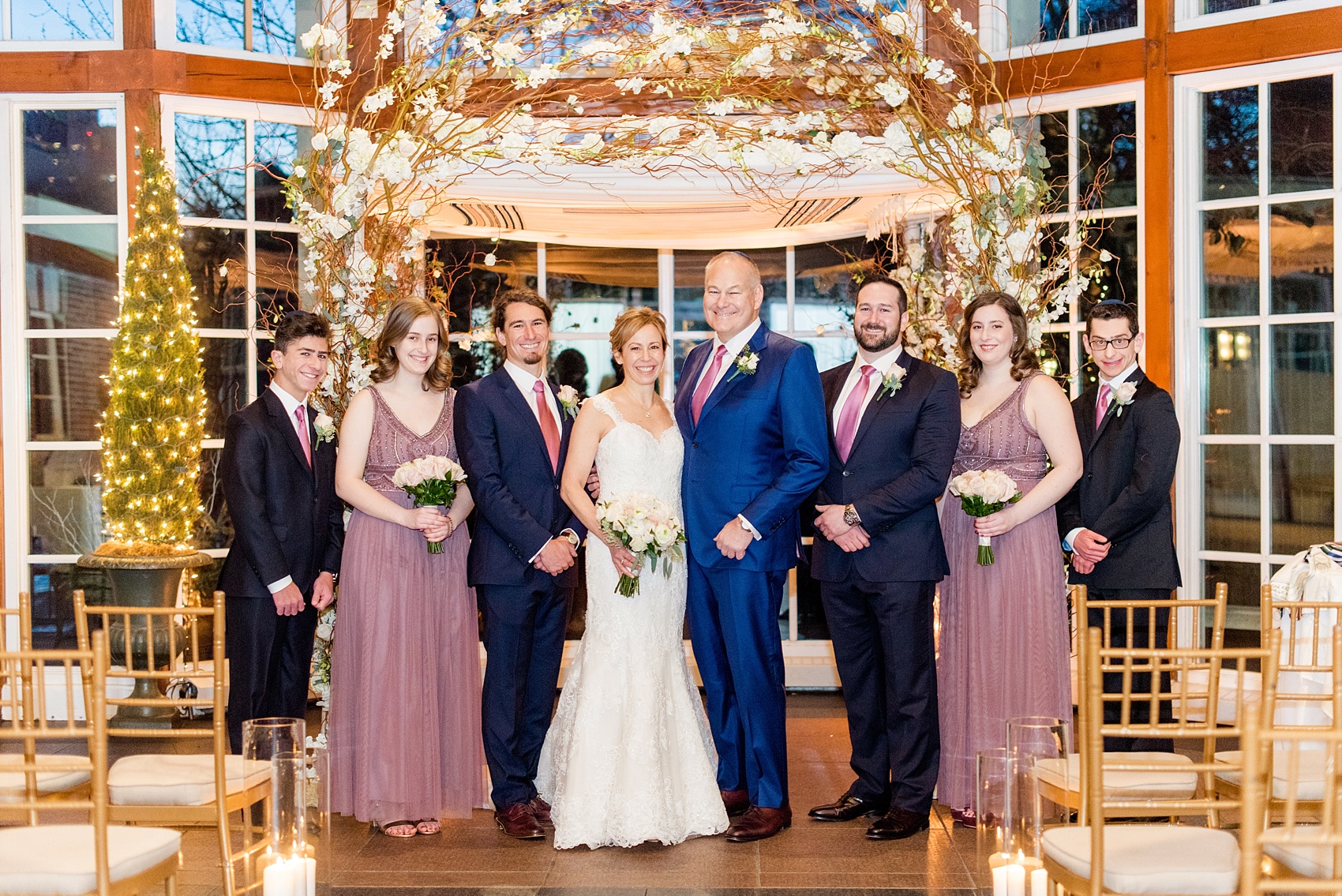 Photos by Mikkel Paige Photography of a Central Park Wedding reception at the Loeb Boathouse venue with a romantic theme. Picture of the bride, groom and their nieces, nephews and son as their wedding party for the winter inspired party. Click through for more images from their day! #CentralParkWedding