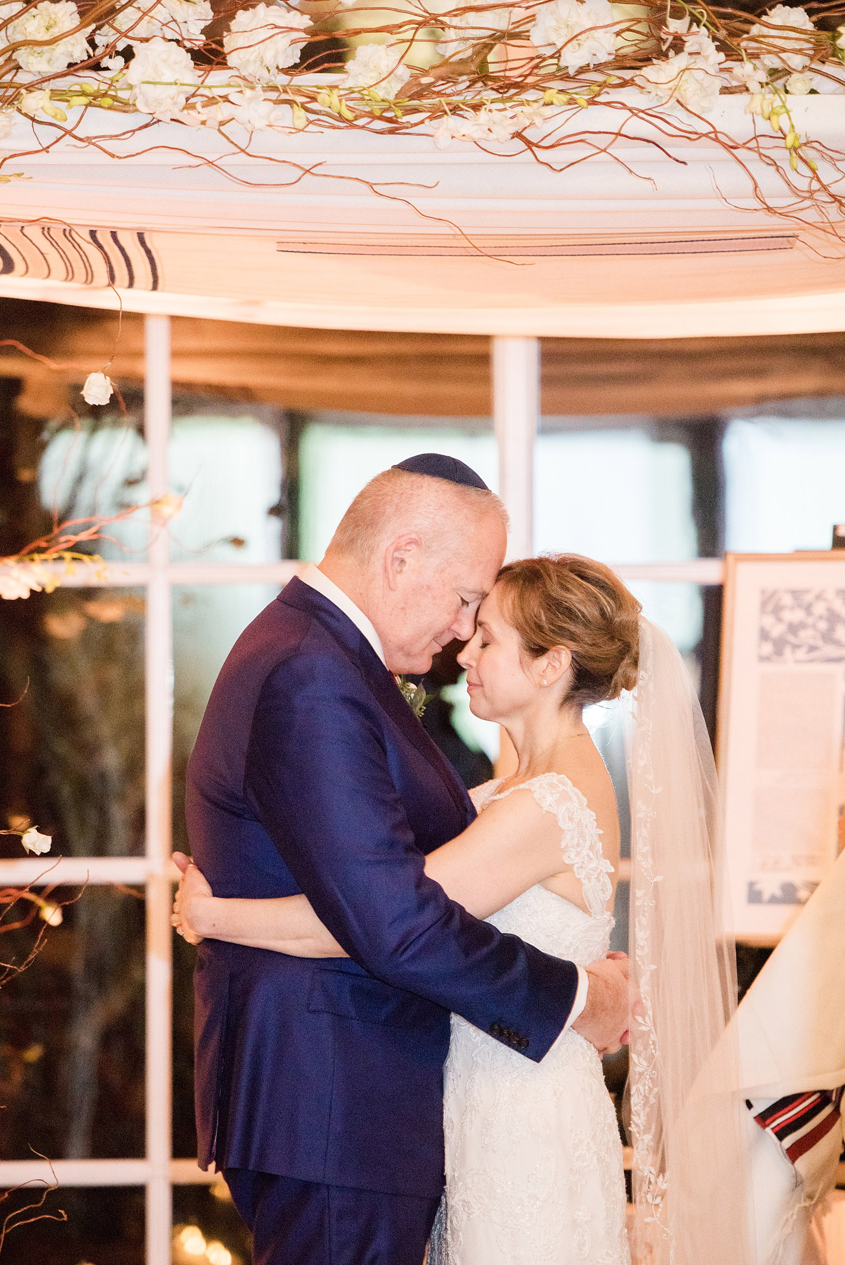 Photos by Mikkel Paige Photography of a Central Park Wedding reception at the Loeb Boathouse venue with a romantic theme. Detail image of the indoor, January winter inspired ceremony and chuppah. Click through for more images from this couple's beautiful day! #CentralParkWedding