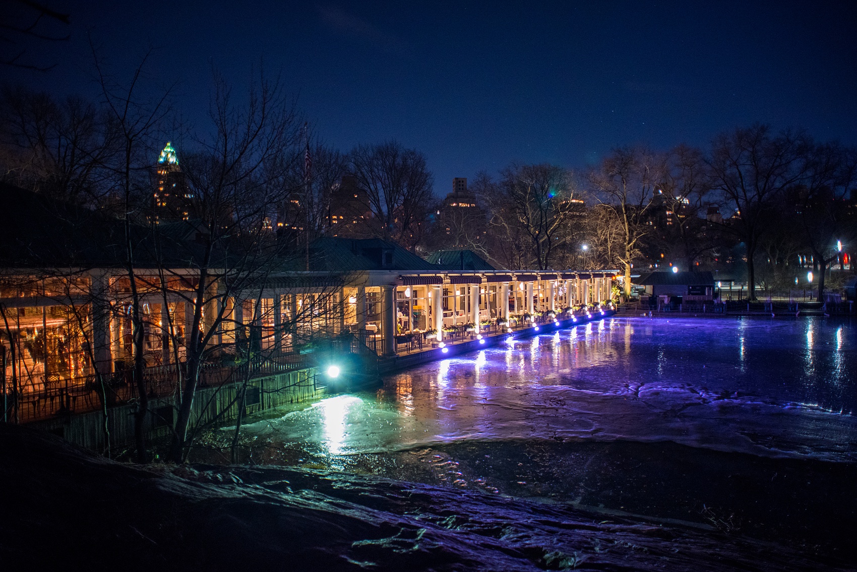 Photos by Mikkel Paige Photography of a Central Park Wedding reception at the Loeb Boathouse venue with a romantic winter theme. Picture of the boathouse at night. Click through for more images from this beautiful day! #CentralParkWedding